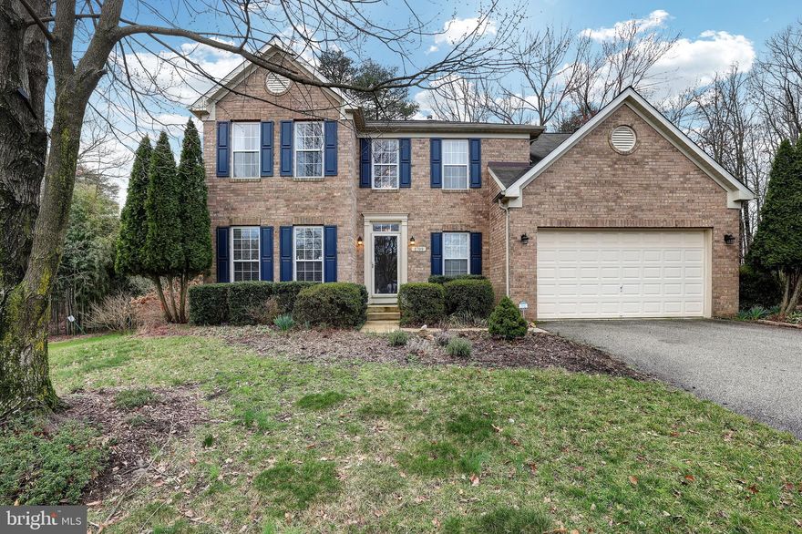 Experience the pinnacle of luxurious living within this meticulously maintained colonial masterpiece, nestled in the serene outskirts of a charming cul-de-sac within the highly sought-after Villages of Dorchester. Immerse yourself in a tranquil ambiance, enveloped by verdant greenery and picturesque trails, while relishing in the modern amenities of gourmet dining, upscale shopping, and the nearby Anne Arundel Mills mall, all just a leisurely stroll away. Strategically positioned mere moments from major thoroughfares including Rt 100, 295, 95, FT. Meade, MARC, BWI, and Annapolis, this sun-drenched sanctuary offers an ideal balance of seclusion and accessibility. With a plethora of recent upgrades and replacements, this residence effortlessly radiates sophistication and comfort at every corner. Enter to discover gleaming hardwood floors bathed in natural light cascading through expansive windows, illuminating the spacious layout. The gourmet kitchen stands as a haven for culinary enthusiasts, boasting updated cabinets and stainless steel appliances that seamlessly blend style with functionality. Retreat to the oversized primary bedroom suite, complete with a cozy sitting area and a luxurious jacuzzi tub in the ensuite bathroom for ultimate relaxation. Additional highlights include four total upstairs bedrooms, two updated upper level baths, a main-level office/fourth bedroom, a sunroom, main level powder room, dining room, living room, a sizable unfinished basement awaiting your personal touches (including a rough-in for another full bathroom), and a serene, low-maintenance deck overlooking the meticulously landscaped yard and wooded backdrop. Convenience meets elegance with thoughtful touches such as built-in closets, ceiling fans in every room, an oversized 2 car garage, and energy-efficient upgrades (including solar shingles, high efficiency wood stove, and new energy efficient AC and heating system), offering not only luxury but also peace of mind in every detail