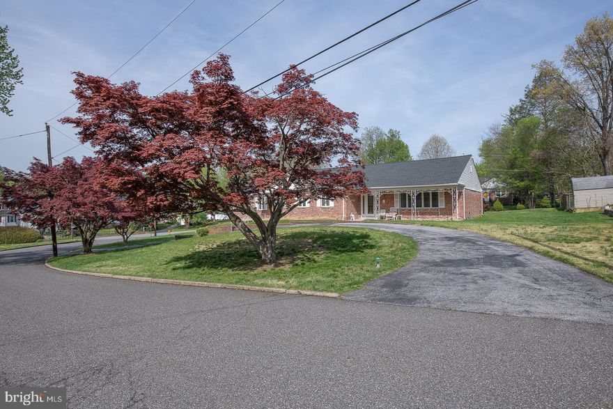 Large Brick Ranch home with flexible floor plan in the award winning Wallingford-Swarthmore school District awaits your finishing touches. This 4+ BR 2 full bath 2 powder room home has generous room sizes and a full basement .  Separate end of the home could potentially be an in-law or au pair suite.  1st floor family room w/brick fireplace and sliders to an enclosed porch with tile floors. Full unfinished basement with PR would make great additional finished space. This home has a 2 car garage as well as 2 separate diveways, 1 of which is circular, which offers plenty of parking. Nearby are both Houston Park and TalyorArboretum. The location offers EZ access to Major roads as well as Philadelphia International Airport.