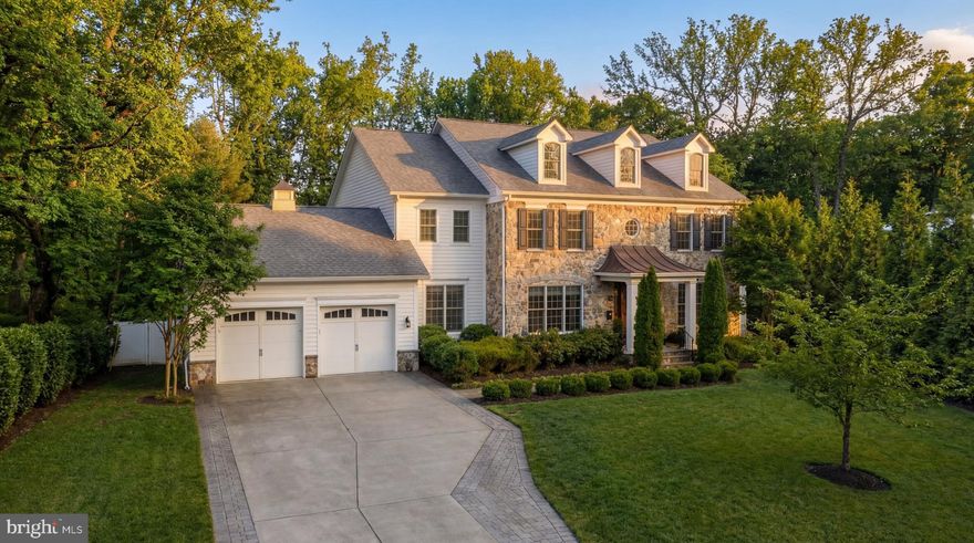 A distinguished offering in Chevy Chase, 3708 Cardiff Court is a 2018 Wormald-built residence that balances scale, structure, and a thoughtfully executed floor plan with over 7,100 square feet of living space across three finished levels. Tucked within a private cul-de-sac on a premier half-acre lot, the home presents a composed architectural presence, where an Arts and Crafts façade of stone and siding is articulated through clean lines and balanced proportions.
 
The approach is both practical and inviting, featuring an enhanced driveway and a covered entry that establish a clear sense of arrival. Inside, striking marble floors span the entire main level, introducing a central foyer that flows effortlessly into formal living and dining rooms, a private study, and an inviting living space anchored by a gas fireplace. The family room transitions seamlessly into the chef's kitchen and breakfast area, creating a cohesive environment for both daily living and entertaining. A walk-in pantry and mudroom connect directly to the two-car garage, which includes a dedicated EV charger, reinforcing convenience without interrupting the home’s natural circulation.
 
Outdoor living extends naturally from the main level. A screened porch, deck, and stone patio are thoughtfully integrated to create a continuous indoor-outdoor experience. The expansive, level backyard is fully enclosed by a classic white picket fence and bordered by extensive mature vegetation, creating an unparalleled sense of privacy. This outdoor oasis is complete with a stone retaining wall, a high-end playset, and a smart irrigation system with a dedicated control panel.
 
Upstairs, the primary suite is positioned as a private retreat, defined by its massive scale, large walk-in closet, and a well-proportioned spa bath. Three additional bedrooms are arranged along a central hall, including a highly functional Jack-and-Jill suite, maintaining consistent ceiling heights and a sense of balance throughout the upper level. The lower level is fully finished and designed for ultimate versatility, complete with a separate private entrance to the backyard. A large recreation room with a wet bar anchors the space, complemented by a dedicated home theater, a fitness room, and a fifth bedroom with a full bath, providing flexibility for both recreation and guest accommodations.
 
Delivering modern convenience through a unified platform, a robust Control4 system flawlessly integrates the home's Lutron window shades, indoor and outdoor lighting, multi-zone speakers, televisions, security system with cameras, smart locks, front door intercom, and garage doors.
 
Conveniently located near the shops and restaurants of Bethesda, 3708 Cardiff Court presents a meticulously composed residence that combines thoughtful design, high-end technology, and a quiet, established setting.
