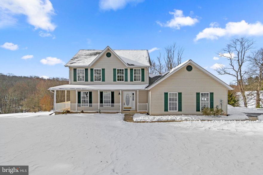 Charming colonial offering 2,042 square feet, 3 bedrooms, 2 full baths, 1 half bath, and a 2-car garage. Meticulously maintained by its original owners, the house sits on a picturesque 3-acre lot in the serene Cabin Branch countryside.

A beautifully landscaped front yard with a wraparound porch invites you into the main level beginning with a welcoming foyer and stylish powder room. To the left, a formal living room with plush carpeting flows seamlessly into the elegant dining room, complete with a timeless chandelier. The open floor plan continues into the kitchen and family room, creating a perfect space for dining and entertaining. The eat-in kitchen is a standout, featuring bay windows, stainless steel appliances, granite countertops, and white cabinetry. Luxury vinyl tile extends into the spacious family room, which boasts a cozy wood stove set against a brick backdrop, soaring cathedral ceilings with skylights, and mini split French doors leading to a bright sunroom with vinyl stacking windows and a cathedral ceiling. A well-appointed laundry room with garage access completes the main level.

Upstairs, the primary suite offers a large walk-in closet and a luxurious ensuite bath with dual vanities, a soaking tub, and a separate shower. Two additional bedrooms share a full bath. The unfinished lower level presents a blank canvas for customization with walk-out access to the backyard. Outside, a Trex® deck with a pergola overlooks the expansive yard, which backs to trees and includes a storage shed.