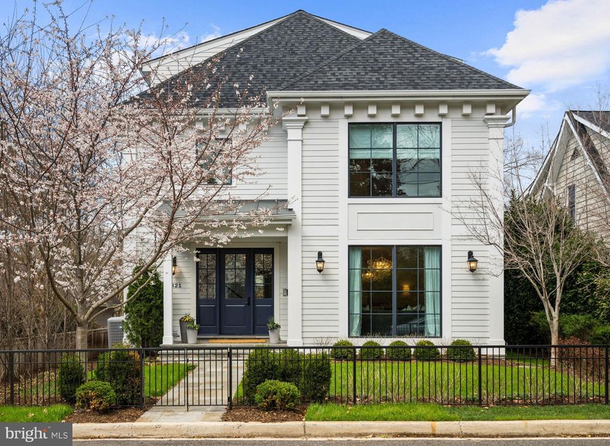Perfectly positioned within the highly sought-after Palisades, this exceptional residence offers nearly 7,000 square feet of beautifully composed living space. Built in 2019 by renowned developer Chryssa Wolfe in collaboration with Hanlon Design Build, and thoughtfully reimagined by its current owners, the home blends timeless architecture with modern functionality while achieving a remarkable level of quality and elevated finish throughout. The main level is designed for both everyday living and elegant entertaining, featuring gracious formal living and dining rooms alongside a more relaxed family room that opens seamlessly to the kitchen. The family room is particularly inviting, centered around a handsome fireplace with custom built-ins and a coffered ceiling, and framed by expansive windows that fill the space with natural light while offering views of the rear terrace and garden. The eat-in kitchen is exceptionally well-appointed, with custom cabinetry, premium appliances, and a generous island, as well as a sun-filled breakfast area that overlooks the property. High ceilings, refined millwork, and abundant natural light define the space throughout. The first upper level is anchored by an exceptional primary suite, notable for its scale, natural light, and serene, understated design. The space easily accommodates both sleeping and sitting areas, creating a true retreat. The spa-inspired bath features Waterworks Calacatta stone, polished nickel fixtures, a freestanding tub, and a glass-enclosed shower, complemented by a generous walk-in closet. Two additional bedrooms on this level are well-proportioned, each with its own beautifully appointed en suite bath. A thoughtfully designed laundry room adds convenience to this level. The second upper level offers a flexible and private extension of the home, featuring a spacious bedroom and a full bath, along with a large additional room that can function as a den, office, or playroom—ideal for a variety of lifestyle needs. The lower level offers high ceilings and expansive living spaces designed for both relaxation and entertainment. A large recreation/media room is complemented by a custom wet bar and a striking glass-enclosed wine storage display. An additional bedroom and full bath on this level provide comfortable accommodations for guests or extended stays. Outdoor living is equally well-executed, with a beautifully designed stone terrace that creates a natural extension of the home. Thoughtfully arranged for both dining and lounging, the space includes a built-in grilling area, fire feature, and multiple seating areas, all overlooking a professionally landscaped yard. A detached garage provides convenient parking and storage, with the guest suite positioned above—each with its own private entrance for added flexibility and privacy. The detached guest suite offers an exceptional level of comfort and versatility, thoughtfully designed as a private, self-contained retreat. The space includes a generous living area with room for both seating and workspace, a well-appointed full bath with refined finishes, and a kitchenette that adds convenience for longer stays. Whether used for visiting guests, a home office, or an au pair suite, it provides a rare combination of privacy, functionality, and finish consistent with the main residence. Ideally located within close proximity to parks, trails, and a vibrant collection of restaurants and shops, the home also benefits from access to a number of highly regarded public and private school options. This is a rare opportunity to own a truly turnkey residence in one of the Palisades’ most desirable settings.