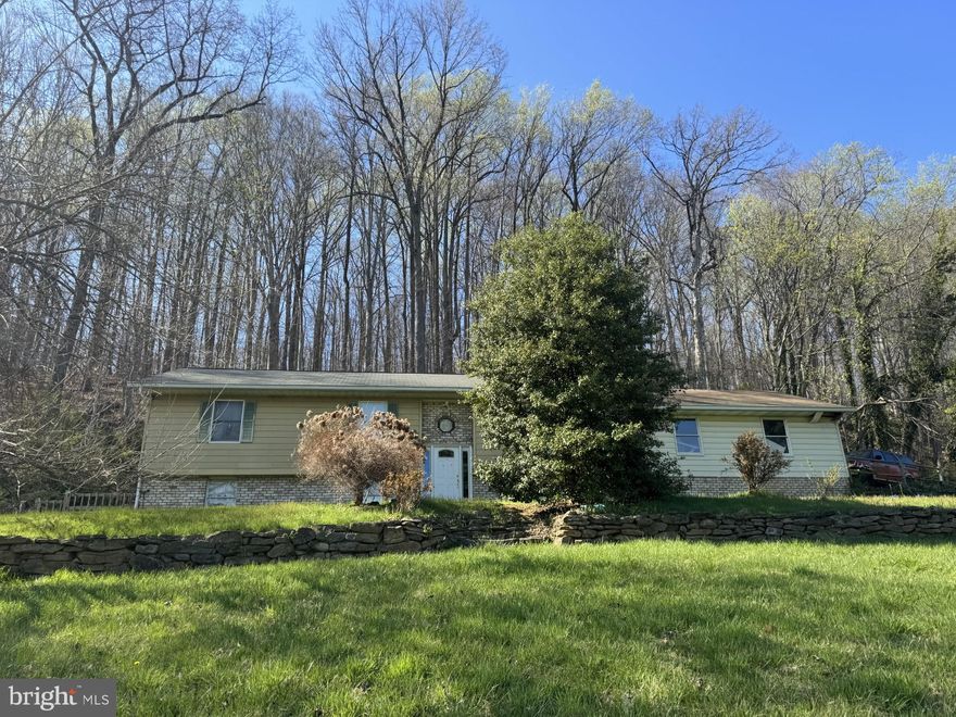 Investor Special. 3 bedroom 2 bath split foyer on 2.7 acre lot plus 1.75 acre adjoining lot 4.45 acres total. 2 tax bills As is where is sale. Hillside property with a nice view. House is in need of major rehab. Currently lived in, possible 10 day rent back needed.