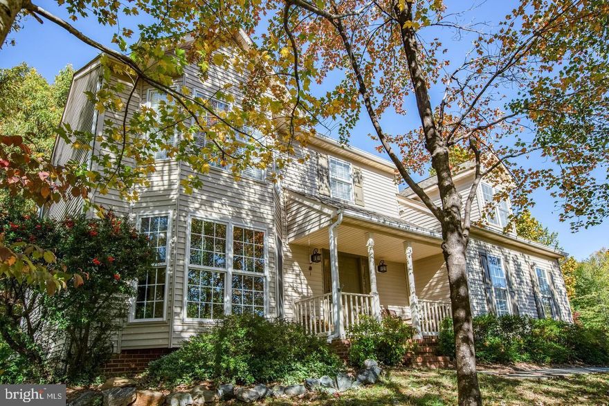 Welcome to this beautifully maintained two-story home nestled on a private, landscaped corner lot in the desirable Watford Village section of Lee’s Hill. From the moment you arrive, you’ll appreciate the charming scenery, mature landscaping, and inviting outdoor living space designed for relaxation and entertaining. The fenced backyard features stone walking paths, a spacious patio with firepit and outdoor lighting, lush hostas, and a stunning mature Japanese maple. Step inside to an inviting hardwood foyer that opens to a formal sitting room with tons of natural light and bay window and a separate dining room adorned with elegant chair rail, custom light fixtures, and wainscoting. The bright eat-in kitchen features quartz countertops, nice center island, and a window overlooking the peaceful backyard—perfect for enjoying the view while preparing meals. Just off the kitchen, the cozy living room offers tile flooring and a charming wood-burning fireplace and vaulted ceilings, creating the perfect gathering space. Upstairs, the spacious primary suite features beautiful hardwood floors, bay window, a large walk-in closet, and a versatile sitting area with a convenient laundry closet housing the washer and dryer with built in shelving. The ensuite bath includes a relaxing soaking tub and a large tiled stall shower. Two additional bedrooms are carpeted, with the larger bedroom has an added bonus finished storage area perfect for a hideout or pet nook. Additional highlights include a two-car garage, asphalt driveway, encapsulated crawlspace, fenced back yard, and more. Residents of Lee’s Hill enjoy fantastic community amenities including playgrounds, basketball courts, tennis courts, and a community pool. Don’t miss the opportunity to own this lovely home combining comfort, charm, great neighbors, and exceptional outdoor living in one of Fredericksburg’s most sought-after communities!