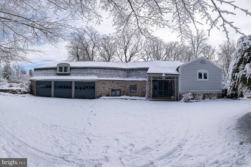 Welcome to your dream home nestled on one of the most sought-after cul-de-sac streets in Lower Merion Twp, just a short stroll from Suburban Square, Haverford Square, the train to Center City and Merion Cricket Club. This stunning sanctuary in Northside Haverford features five spacious bedrooms and four full baths along with an additional two half baths, expertly reconfigured and tastefully modernized for today’s lifestyle. The sunny custom kitchen includes streamlined Porcelanosa cabinetry and tile flooring, and is anchored by an oversized Krion topped island. Bosch appliances include double ovens and an induction stovetop, a wine refrigerator and Miele dishwasher. A cozy family room with a dual sided fireplace offers two seating areas to enjoy the cozy fire on winter days. The entire rear of the house walks out to a beautiful expanded flagstone patio perfect for entertaining and al fresco dining while overlooking scenic valley views. The formal dining room is adjacent to the kitchen and has folding doors that can be closed to offer a more intimate setting or open to create a more casual experience. The spacious living room has a fireplace offering aesthetic appeal with beautiful built-in designs against a backdrop of stunning natural views as well as views of the pool. A first floor office /sunroom which also leads to the flagstone patio makes a wonderful place to work or relax. Upstairs find the luxurious primary suite with a spa like soaking tub and walk in shower, dual sinks and two walls of custom built cabinetry providing ample closet storage. Enjoy a cup of coffee or glass of wine off your own private primary balcony and oversee the beautiful landscape. A second ensuite bedroom offers a walk-in shower. Two additional bedrooms complete the second floor with a Jack and Jill bathroom. A separate linen room offers a laundry chute and provides access to the third floor, which makes a perfect au pair/guest suite/gym/second office with two additional rooms as well as a full bathroom. This suite can also be accessed directly from the back stairs that lead down to the garage so as to maintain its privacy. Radiant heat in the family room and mud room entry, an abundance of storage space, 3 car garage, newer heated pool, all in Lower Merion School District this move-in ready home offers a perfect blend of modern amenities and classic charm, set in a fabulous neighborhood that prioritizes lifestyle and convenience. You’re just steps away from restaurants, shopping, the train and recreational activities, making it an ideal setting for both relaxation and entertainment. A rare chance to move into this exceptional neighborhood and enjoy this beautiful sanctuary, where every detail has been thoughtfully crafted.