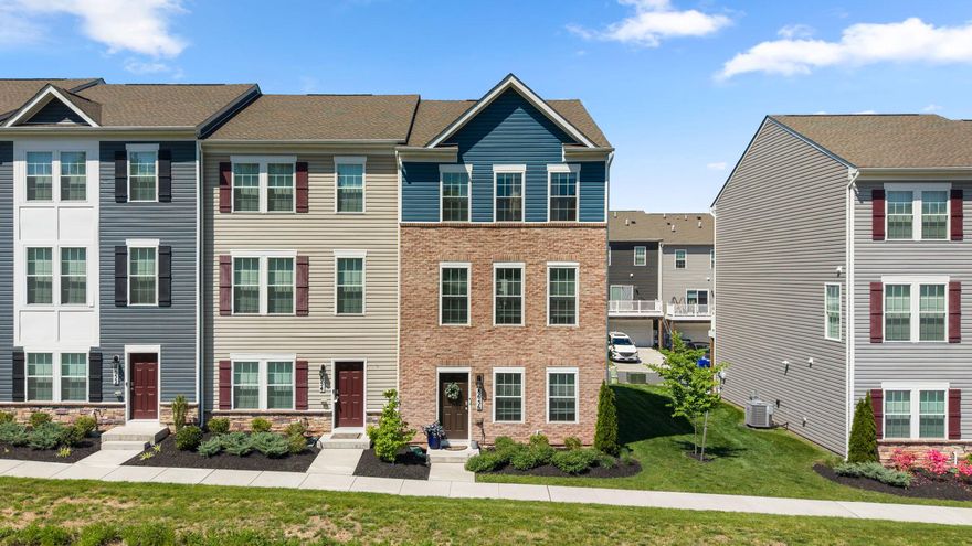 Beautiful end-unit townhome offering three finished levels, four bedrooms, and 3.5 baths with a spacious open floor plan and abundant natural light from front and side windows. The main level features stylish LVP flooring, recessed lighting, and an enormous Living Room perfect for entertaining. The stunning center island Kitchen boasts 42" white shaker cabinetry, granite countertops, stainless steel appliances, undermount sink, undercabinet lighting, and generous prep and storage space. The upper II level  features a spacious Primary Suite with ceiling fan, walk-in closet, and a beautifully appointed bath with recessed lighting, double shaker-style vanity, granite counters, and under-vanity lighting. Two additional bedrooms, both with ceiling fans, share a hall bath with granite vanity and tub/shower combination. Convenient bedroom-level laundry with washer, dryer, and extra shelving adds everyday convenience. The entry level offers a private 4th bedroom and full bath, ideal for guests, home office, or multi-generational living. Completing this exceptional home is a rear-entry attached two-car garage.
