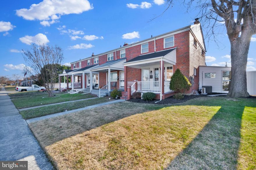 End of Group townhome in Stanbrook designed with warm elegance boasting two spacious additions ideal for entertaining! Arrive & be greeted by a covered front porch and landscaped front gardens. The covered front porch with white painted brick is ideal for morning coffee or afternoon tea. The living room is filled with natural light from the tall front windows. This space is appointed with crown moldings & luxury vinyl plank flooring leading you through. The open dining room is accented by a wall treatment adorned with natural wood jewels. A kitchen awaits with lighting illuminating the granite counter & backsplash with stainless steel appliances. The electric fireplace with floor to ceiling stone tile takes your immediate attention as you enter the family room addition with recessed lighting. Imagine large gatherings with a 2nd side addition with a built-in bar illuminated by accent lighting & skylights, perfect for watching sports all year round comforted by the warmth & cooling from the new mini-split system. The luxury vinyl plank floors continue to the fully finished basement with a 2nd electric fireplace. The basement bath has a rain style shower with hexagonal tile floor brushed nickel hardware. Upstairs find three spacious bedrooms with LVP flooring & plentiful closet space. The upper bath is finished in tile with built in shelving to the tub shower & rain fixture. A pull-down attic offers additional storage. Enjoy the convenience of the rear carport or utilize this space as a covered patio for entertaining on those summer days. A large storage shed is perfect for outdoor furniture and garden tools. Have peace of mind with a new Rheem furnace & water heater. Dundalk is home to several waterfront parks, restaurants, & marinas for those who enjoy the water. Your next chapter begins with this elegant home.