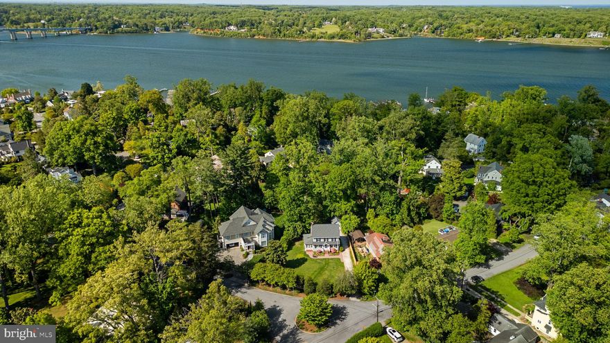 COMING SOON IN ANNAPOLIS! This classic 1940 Dutch Colonial offers timeless character, generous living space, and an unbeatable Annapolis location. Situated on a quarter acre lot with large front yard, the south facing location ensures sunny days ahead! Located in the elegant Wardour community which reflects the naturalistic style of its designer, Frederick Law Olmstead, Jr, with its mature trees, meandering roads and preserved open spaces that foster community connection.
Inside, the home features five bedrooms, two bathrooms, gorgeous oak floors (recently refinished in 2026), fireplace, bright sun-porch and large 12x 32 back deck. The south-facing orientation fills the home with natural light, creating a bright and cheerful atmosphere throughout. Recent improvements include freshly painted interior and exterior spaces, a newer roof approximately four years old, new porch benches, and a beautifully installed brick paver sidewalk that enhances the home’s curb appeal. A long driveway and rear detached garage provide ample parking and storage.
Residents benefit from access to seven community beach areas and a shaded walking trail traversing the neighborhood, that provide a tranquil retreat for adults and a natural wonderland to explore. Conveniently located within walking distance of the local elementary school, Navy Stadium, Annapolis Street shopping and dining, Historic Downtown Annapolis and offers easy access to Rt. 50 for commuters. With classic architecture, spacious interiors, abundant natural light, and an exceptional in-town location close to everything Annapolis has to offer, this is a rare opportunity to own in one of the area’s most beloved neighborhoods. Schedule your private tour today!