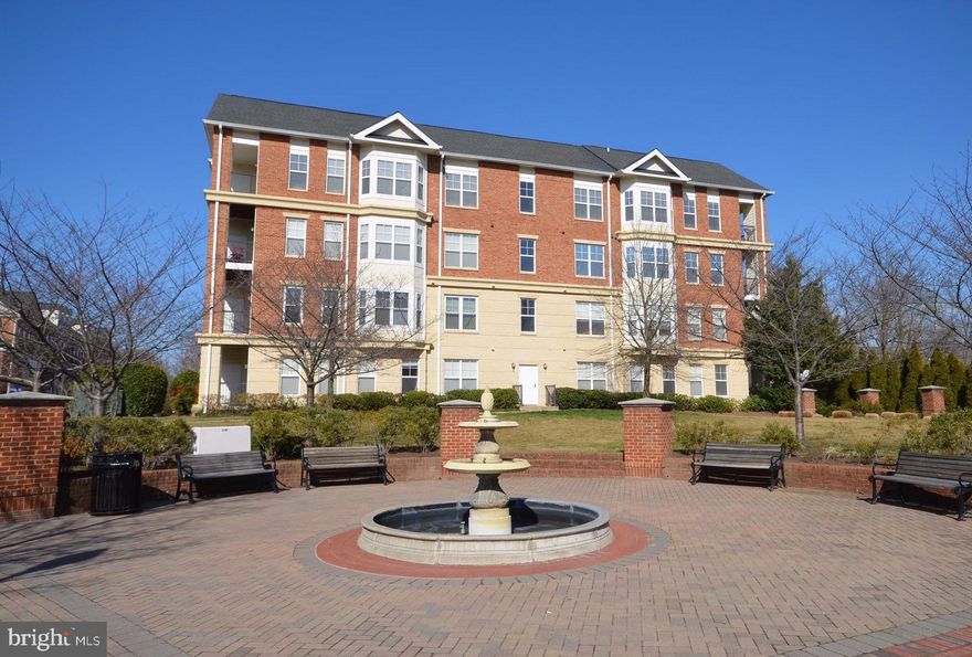 Enjoy the open floor plan of this charming penthouse unit in walking distance to historic downtown Herndon and the W&OD bike trail.  Gleaming hardwood flooring throughout the unit.  The primary suite includes a spacious ensuite bathroom with dual vanities and separate tub and shower.  The  dual closets including a large walk-in closet with convenient built-ins completes the primary bedroom.  The gourmet kitchen includes gas cooking, a built-in microwave and a breakfast bar and the kitchen opens to both the living and dining rooms.   One garage parking space (#30)  is included.  Washer and dryer included in unit.  Balcony overlooking trees below.  Sorry, no smoking or pets permitted.