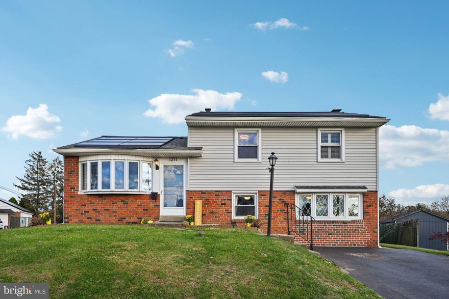 Extensive updates totaling over $186,000+  Stop your search, this home has it all! Highlights include new siding, new architectural roof equipped with 30 GAF Decotech solar panels, and comprehensive interior renovations including refinishing the original hardwood floor, and a fully remodeled bathroom & kitchen. The pool has undergone a complete renovation, now boasting new saltwater equipment, fresh plaster, and new concrete decking. Additionally, a beautiful new shed and fence enhance the outdoor space. The value this home brings is unmatched!
1211 Woodside Road, a meticulously maintained split-level home that harmoniously blends comfort, modern enhancements, and remarkable outdoor amenities. Nestled on a generous lot, this property seamlessly combines classic charm with contemporary improvements, making it an ideal sanctuary to call home this holiday season. Full list of improvements provided to all prospective buyers!
Property Features
Bedrooms: 3
Bathrooms: 1.5
Style: Split-level
Bonus Spaces: Bonus room in lower level and mudroom
Lot Size: Expansive lot with ample outdoor space
Pool: In-ground saltwater pool
Highlights
New Roof: Recently installed in 2021, ensuring peace of mind and long-term durability. Including a 25 YEAR WARRANTY!
30 Panel GAF Decotech Solar Tiles: Energy-efficient system designed to reduce utility costs, and comes included with the home sale!
Spacious Layout: Thoughtfully crafted split-level floor plan that facilitates separation and flow between living areas.
Bonus Room: Versatile space suitable for a home office, playroom, or guest accommodation.
Mudroom: Convenient access from the back patio, crafted for maximum storage and organization.
Outdoor: An expansive backyard boasts a shimmering saltwater pool, ideal for both relaxation and entertaining. Enjoy excellent privacy, complemented by a beautiful new fence and shed!
Location: A sought-after neighborhood, and NO HOA! 1211 Woodside Road boasts convenient access to local schools, parks, shopping, and dining. The tranquil residential setting combined with proximity to essential amenities makes this home a unique find.