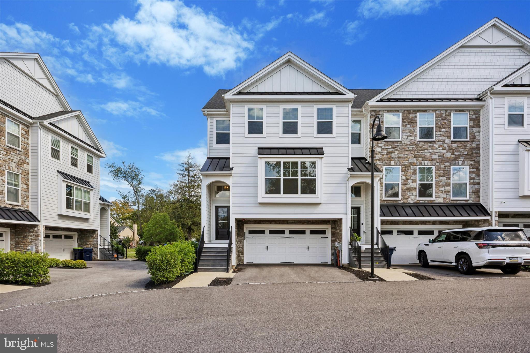 Welcome to 4109 Addison Court at the Knolls of Whitemarsh! This four-year old townhome built by Marc Salamone Homes is located in the highly desirable Colonial School District in Lafayette Hill. A sun-filled end unit boasting large, picturesque windows, this 3 Bedroom and 2 1/2 Bathroom home has a large, open concept living area with a gourmet kitchen that is complete with upgraded soft-close cabinets and pull-out drawers, quartz countertops, and an extra-long island that is perfect for entertaining. A large walk-out deck provides additional space to entertain, barbeque, or simply enjoy the peaceful outdoors. Upstairs, you will find a luxurious master bedroom with a large walk-in closet and an immaculate en-suite bathroom with a double vanity and large mirror cabinet, and two additional spacious bedrooms and a hall bathroom. For added convenience, the laundry area is located on this floor. The lower level is a fully finished walk-out basement with patio that would be great as a home office, entertainment room, or gym. There is an attached two-car garage with additional storage. Situated in a small, quiet townhome enclave nestled among landscaping and greenery, yet close to shopping, dining, parks, hiking trails, and with easy access to major highways and the SEPTA regional rail, this home provides the ultimate in comfort, convenience, and serene living. A must see, this well-kept home won’t last long!