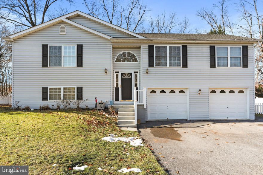 Explore the charm of this move-in-ready 3 bed, 2.5  home. This house offers a serene backyard, an enclosed sunroom, and a spacious lower patio. Open floor plan with new flooring. The kitchen boasts ample cabinet and counter space. Full finished lower level with walk out. Oversized garage with storage and work area. Don't miss out on this beautiful property!  Professional photos to come!