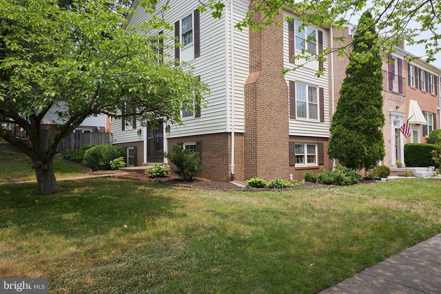 Open House Saturday, June 17 from 2-4pm!

Fantastic opportunity to own this lovely bright and spacious updated end-unit in Mount Vernon Square with over 2200 Sq FT. This side entry townhome provides a unique floor plan with a central staircase that lives like a single-family home.  **A brand New Roof is being installed! 
Upon entry from the foyer lies a magnificent living room space that anchors the Main Floor; off the living room is a den/office/library with a powder room perfect for a home office, guests, or a quiet reading area. The other end of the living room is a generously sized dining area and Chef's kitchen boasting ample cabinetry. This beautifully renovated kitchen, with newer cabinets, granite counters, and recessed lighting, has been opened to the dining area with a peninsula that creates a perfect entertaining gathering spot. Sliding glass doors in the dining area lead to a delightful private patio for al fresco dining, light gardening, and barbecues. Wood floors and light from 3 directions make the main level a warm and inviting space to relax and entertain. The upper level features three nicely sized bedrooms and two full baths. The primary bedroom includes an ensuite and two closets. The Lower Level isn't your typical basement; high ceilings and good-sized windows, plenty of natural light on two sides make this space the perfect hang-out and enjoy family and friends. Special features of this level include a brick-faced wood-burning fireplace, wet bar, half bath, and a large laundry/utility room with extra space for storage or creating a fourth bedroom. Two assigned parking spaces make parking a breeze—a floored attic for additional storage. Close to I495, I95, Richmond Hwy, Huntington METRO, Oldtown Alexandria, National Airport, Pentagon, and the Amazing Amazon's HQ2. Minutes to Fort Belvoir, Old Town Alexandria, Kingstowne, and Mount Vernon. Close distance to schools, parks, and a dog park. Two assigned parking spots and ample guest and street parking. Huntley Meadows Park is a gem to enjoy a morning or evening stroll with scenic views.