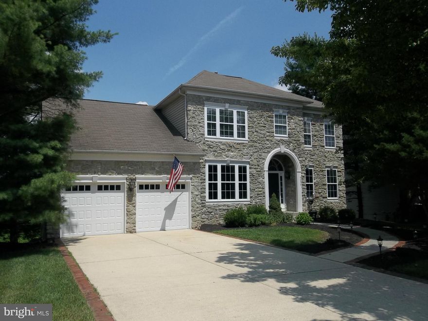 BACK ON MARKET  Elegant stone front Colonial w/absolutely spectacular panoramic views from custom deck! Former Model, great floor plan w/tons of windows on every level! 5 Spacious bedrooms, 9' ceilings, Mahogany hardwoods,Gourmet kitchen w/island, Corian counters,all appliances, Huge study,1st fl laundry! Fully fin lower level w/walkout. Owners suite w/super bath! Quick Access BWI, Baltimore & DC!