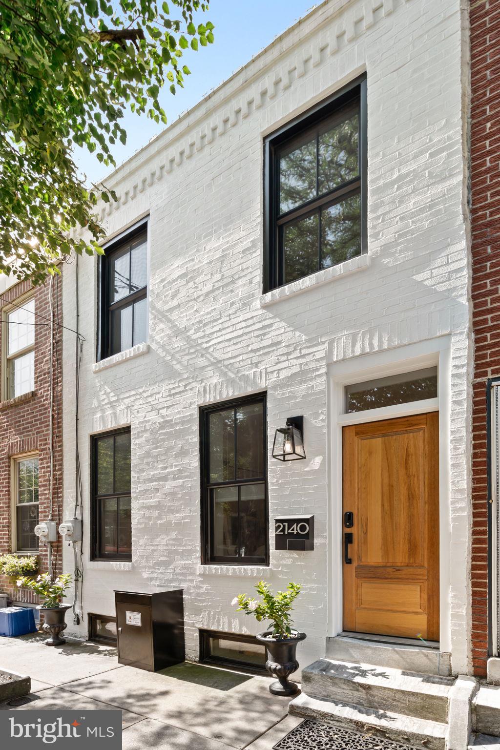 2140 St. Albans Street | Graduate Hospital
Welcome to 2140 St. Albans Street, a bright, sun-drenched, beautifully and impeccably renovated 2-bedroom, 1.5-bath home on a highly coveted, quaint and charming tree-lined block in the heart of Graduate Hospital.
This move-in-ready home offers a perfect blend of historic charm and countless modern upgrades; no corner left untouched. Step inside to find an impeccable, open main level featuring gleaming hardwood floors and custom millwork. Fresh, crisp white painted walls, custom molding and modern lighting invite you into this fully renovated row home. The spacious living and dining areas flow seamlessly into a stunning kitchen outfitted with Silestone countertops, GE Café appliances, sleek custom cabinetry, a stylish hand painted tile backsplash and exposed brick—chic and functional and perfect for both daily living and entertaining. Custom cabinetry, expertly designed storage and a glass paned door leading to a fenced, private back patio/outdoor garden space.
Upstairs you will find two spacious bedrooms and a fully updated hall bath with built-in shelving, a double vanity and contemporary finishes and custom closets. A convenient half bath is located on the main level just off the kitchen area. Enjoy the ease of everyday living with thoughtful upgrades throughout, including central air, recessed lighting, all new Renewal by Anderson windows, solid wood interior doors and high-end appliances.
Access to the fully finished lower level, offering estimated additional 300-350 sqft of living space (not included in the 840 sqft) is just off the kitchen. The exposed brick-lined staircase leads the way towards a stylish and functional living space with custom built-ins, a cozy firebox feature, and a thoughtfully designed laundry area. There’s also plenty of extra storage, making this level perfect for a media room, home office, gym, or guest overflow.
Out back, a private patio provides the ideal spot for morning coffee, grilling, or container gardening.. Additional highlights include new HVAC, high-efficiency systems, new roof, and a fantastic location just blocks from parks, shops, dining, and easy access to Center City.
All of this in a fantastic location—just steps from neighborhood favorites, parks, shops, and easy access to Center City. This is city living at its best-- 2140 St Albans is your opportunity to call this expertly renovated home on this quiet, tree lined street your "home sweet home".