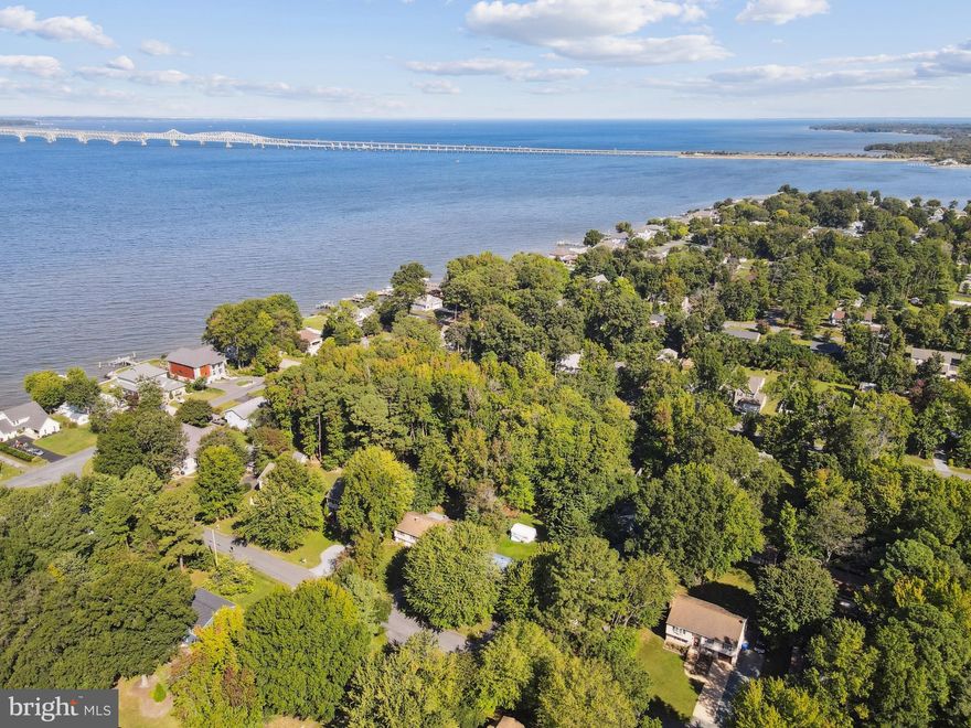 Welcome to your storybook cottage in Bay City, Stevensville—just steps from the shimmering waters of the Chesapeake. This isn’t just a house; it’s a lifestyle. Imagine morning coffee with water views, evening strolls by the pier, and sunsets that look like they belong on a postcard (or better yet, a Hallmark movie).

Community Perks You'll Love
Bay City is one of Kent Island’s most sought-after neighborhoods for a reason. Enjoy two waterfront parks—one with a brand-new playground within walking distance, the other offering a sandy beach, boat ramp, picnic pavilion, kayak racks, and a pier perfect for launching small craft or simply soaking in the views. Shopping, dining, and outdoor recreation are minutes away, and with Route 50/301 nearby, the Bay Bridge commute is a breeze.

 Inside Your Cottage Retreat
This 3-bedroom gem has been refreshed top-to-bottom with $50,000 in recent upgrades:
A dream kitchen with quartz counters, a farmhouse sink, custom cabinetry, and an oversized LG refrigerator.
A spa-inspired bath featuring ocean-blue tile, marble floors, and all-new fixtures.
Fresh flooring, paint, and a welcoming front porch.

Natural light fills the versatile floor plan, and select rooms even frame the water. Want more? The front porch could become extra living space, or picture a rear deck overlooking your spacious backyard.

The Outdoors: Room to Grow
On nearly a third of an acre, the lot features majestic 200-year-old trees at the front and ample open space at the back for a garage, garden, or private retreat. A long driveway accommodates multiple cars—and yes, even your RV. The home also features a durable metal roof and a fully finished attic. *Shed is not warranted nor guaranteed to be structurally solid.*

 Why Wait?
This Bay City cottage blends timeless charm with thoughtful updates, all in a water-privileged community where the sunsets will stop you in your tracks. Opportunities like this don’t linger—schedule your private showing today and start your Chesapeake chapter.