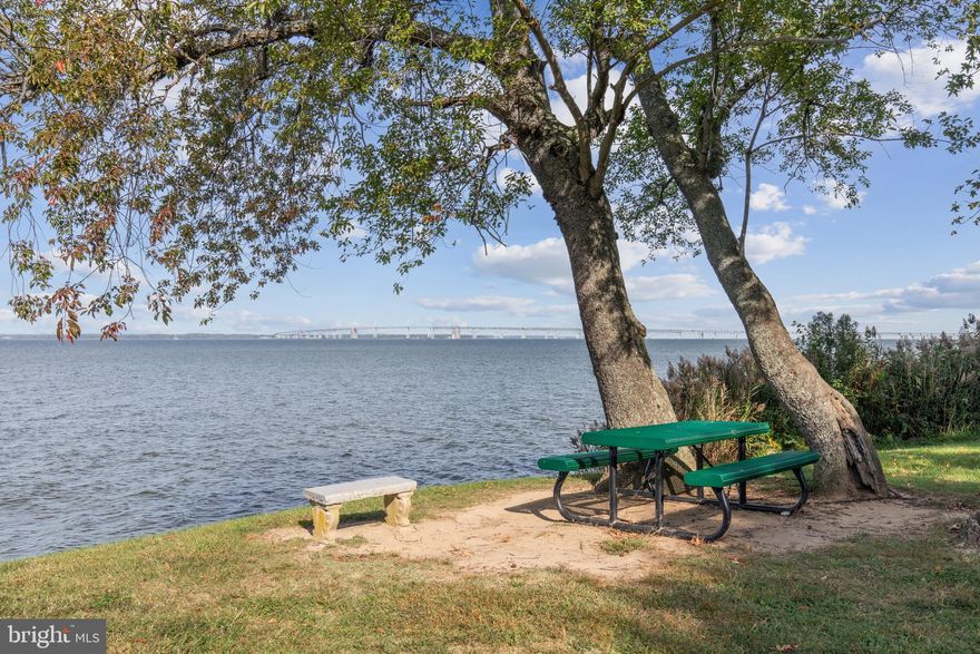 Welcome to your storybook cottage in Bay City, Stevensville—just steps from the shimmering waters of the Chesapeake. This isn’t just a house; it’s a lifestyle. Imagine morning coffee with water views, evening strolls by the pier, and sunsets that look like they belong on a postcard (or better yet, a Hallmark movie).

Community Perks You'll Love
Bay City is one of Kent Island’s most sought-after neighborhoods for a reason. Enjoy two waterfront parks—one with a brand-new playground within walking distance, the other offering a sandy beach, boat ramp, picnic pavilion, kayak racks, and a pier perfect for launching small craft or simply soaking in the views. Shopping, dining, and outdoor recreation are minutes away, and with Route 50/301 nearby, the Bay Bridge commute is a breeze.

 Inside Your Cottage Retreat
This 3-bedroom gem has been refreshed top-to-bottom with $50,000 in recent upgrades:
A dream kitchen with quartz counters, a farmhouse sink, custom cabinetry, and an oversized LG refrigerator.
A spa-inspired bath featuring ocean-blue tile, marble floors, and all-new fixtures.
Fresh flooring, paint, and a welcoming front porch.

Natural light fills the versatile floor plan, and select rooms even frame the water. Want more? The front porch could become extra living space, or picture a rear deck overlooking your spacious backyard.

The Outdoors: Room to Grow
On nearly a third of an acre, the lot features majestic 200-year-old trees at the front and ample open space at the back for a garage, garden, or private retreat. A long driveway accommodates multiple cars—and yes, even your RV. The home also features a durable metal roof and a fully finished attic. *Shed is not warranted nor guaranteed to be structurally solid.*

 Why Wait?
This Bay City cottage blends timeless charm with thoughtful updates, all in a water-privileged community where the sunsets will stop you in your tracks. Opportunities like this don’t linger—schedule your private showing today and start your Chesapeake chapter.