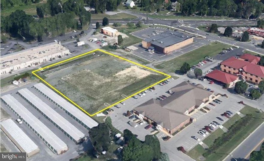 1.61 Commercial Acres. Existing entrance off Parsons Road. Driveway in place. Site plan approved. Fees paid for traffic light. Site has curb & gutter in place and building pad site is ready for a foundation. Site Plan for 7,150 SF building & 10,150 SF building