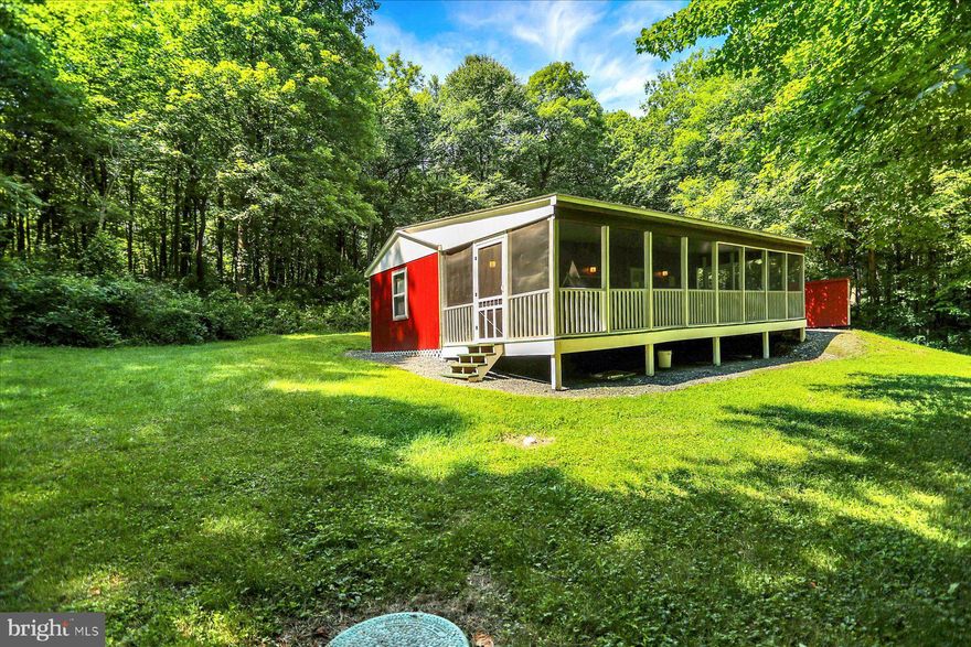 This is it! If you have always wanted a little rural secluded cabin on 28 + acres that is less than 6 miles from Rt 322, here it is! The sweetest little cabin with a kitchen/dining. living room combo, a full bath with a shower, and a bedroom with a large front screened porch is the true definition of a getaway. Nestled in the woods with electric baseboard heat for wintering over, a wood stove, 200 amp electric service, a well and private septic, this has all that you need.  The little red shed for your mower and other equipment and rear yard with a couple apple and persimmon trees round it out. Property consists of a 12.55 acre parcel and a 15.5 acre parcel.  You can hunt from your yard or find your favorite spot in the woods. Hunting blinds are not included.  Close to Port Royal Speedway for weekend racing fun, the Juniata River for fishing, row boating, kayaking, or tubing. The county also has multiple state forest areas and trout streams. If you like the stars, they tell me that they are amazing here due to no light pollution. Please make an appointment in order to visit the property as it is on a private road.  You just don't know unless you go so come take a look.