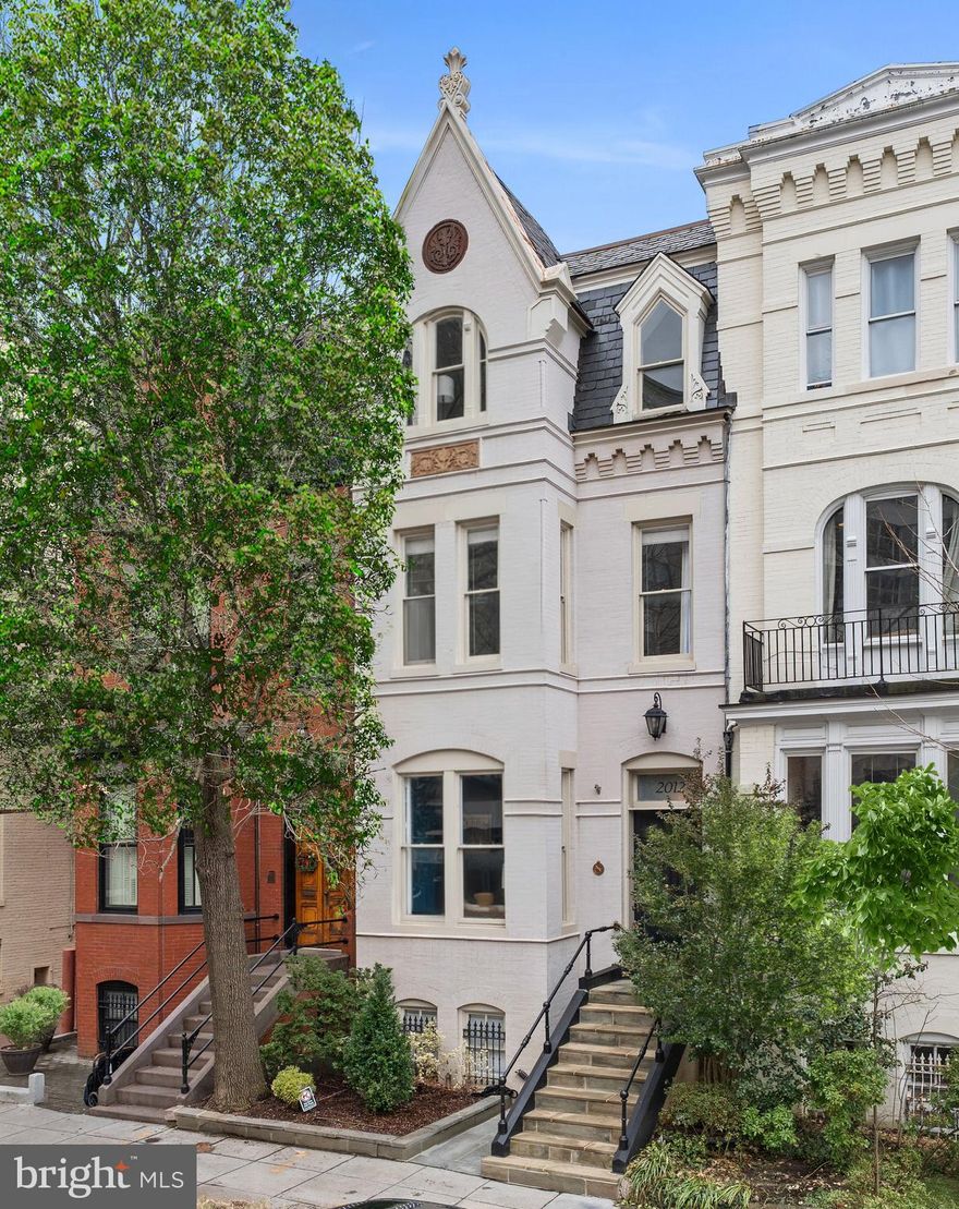 New Listing!
Tucked on the south side of cherished, centrally located Hillyer Place, a one block long, one way lane in Dupont Circle, two blocks to Metro and a half block to Michelin star dining, cultural centers such as The Phillips Collection and the iconic, weekly Dupont Farmers Market, this stunning 5 bedroom plus office, 3.5 bath Victorian townhome is offered in pristine, move-in condition. Stylishly renovated in 2020, the property sparkles with natural light from top to bottom. Every amenity offers the highest level of comfort while showcasing a sophisticated, urban lifestyle. The main level and upper levels feature lofty ceilings. A gracious living room with gas fireplace and built-in display cases opens to a large dining area (seats up to 14!) and spectacular kitchen with bar and tall windows across the rear façade. Here, French doors open to the expansive, private terrace. Upstairs 4 luxurious bedrooms plus a full laundry room and a bright, private office may be found. Enter the exceptional primary suite, where a romantic bedroom with fireplace and window seat, ample closets and a sumptuous bathroom with double vanity, soaking tub and separate shower surpass the imagination. A second bedroom and generous laundry room complete this level. The top floor soars with two spacious bedrooms, an office and full bathroom with double vanity. In addition, a fully renovated and leased lower level one-bedroom apartment with front, rear and interior access ensures both privacy and flexibility. Secure, covered, on-site parking for at least two cars completes this exceptional property. This IS a "MUST SEE" home!
