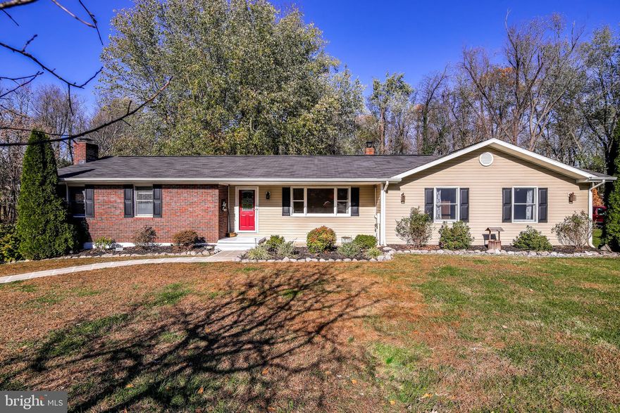 Fantastic opportunity to own an updated and upgraded rancher in lovely Eldersburg!  This home has had many updates, and was expanded on both levels to include a second master suite and a large family room.  This home offers a kitchen with updated cabinetry, granite counters, and stainless appliances.  Three full baths on main level have all been upgraded.  Main level features hardwood flooring throughout.  Walkout lower level offers a rec room with a woodburning fireplace, fourth full bath, den, laundry room, and a huge storage area/workshop.  Exterior amenities include a deck, fencing, and the adjacent open parcel.  Roof,  HVAC system, driveway and siding have all been  updated. Truly a wonderful home.
