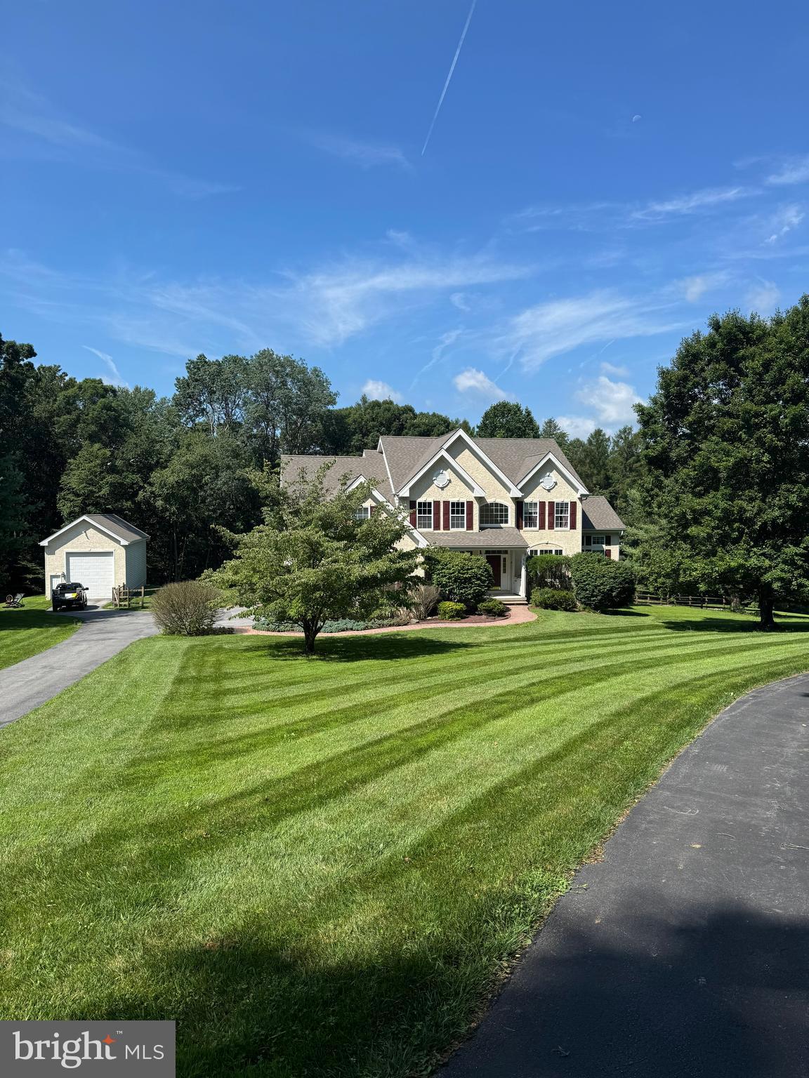 Wonderful setting to this five bedroom 4 1/2 bath two story home. located in the back of the community on a private drive. Very peaceful wooded setting backing to the Big Elk Creek and overlooking a pond. Lots of room beautiful kitchen that offers plenty of cabinets and counter very large dining area that is perfect for large gatherings. Just off the kitchen is the Family room and large conservatory with 12 ft ceilings and lots of windows. The front of the house has formal living room with gas fireplace and large dining room. First floor office or den Four bedrooms on the second floor, including the primary suite with sitting area and luxurious bath with soaking tub, large shower, and walk in closet. Bedrooms 2 &3 have Jack/jill bath. 4th bedroom next to laundry room has full bath. Finished basement adds additional 1200 feet with 5th bedroom , game room with pool table recreational area with built-in bookcase , gym and full bath. 3 car garage plus a huge 20x50 detached garage that was originally designed to accommodate an RV so you have a lot of room. Roof is new , both gas furnaces and central air have been upgraded. Fenced back yard. This was a wonderful place to raise our family and they are all grown it’s time for a new family to make great memories!