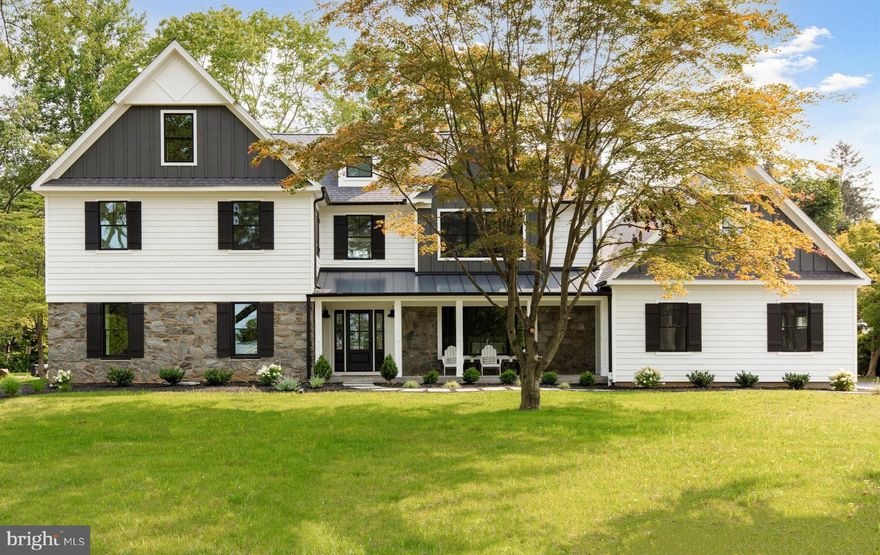 Exceptional quality and craftsmanship define this 4,200 sq ft newly constructed showcase home by EBuild Construction LLC in the desirable Canterbury Woods section of Berwyn. Included in the sale is a builders warranty and custom landscaping including newly planted Green Giants to enhance the property's privacy. The builder kept the original stone walls with deep sills and the original well-built foundation which are rare finds in new construction. It also keeps the taxes much lower than any other newly constructed home. Complementing the stone,  is Hardie Plank siding, Azek trim detail, custom made shutters, and black framed Pella windows. The front covered porch with flagstone features a metal roof, and a front door all in tone with the façade. When you step into the foyer you will notice the modern feel of this home combined with natural light. The rustic oak flooring in a warm earth tone and custom millwork and moldings continue throughout. The formal living room leads you to a private study with custom coffered accent wall and 10-light glass door. The dining room gives an upscale atmosphere warmed by a gas fireplace, brass wall fixtures, and custom wainscoting which helps promote an inviting tone for dining.  The heart of the home, which is the stunningly designed kitchen, has a morning room that is completely open to the family room. It features a center island with seating for six, a farm-style sink, wetbar with wine refrigerator, and GE Monogram appliances including a custom paneled refrigerator, double wall oven, 6-burner cooktop, and a pot filler. The under-cabinet lighting highlights the picket-style tile backsplash and the quartz countertops. The morning room features a coffered accented ceiling and provides access to the composite deck. The family room provides you with a comfortable space warmed by an exquisite fireplace with granite and picket-style tile accents. The mudroom with built-in hall tree and two double coat closets gives access to the 3-car garage. On the opposite side of the home, you will find a private hall that leads to the powder room and to a bedroom with a fully exclusive bath that is perfect for a 1st floor primary bedroom, or a place for inlaws or guests. The tile bath features an oversized stall shower with bench seat, porcelain tile accent. and a granite topped vanity. The 2nd floor features an open hallway with a seating area. It leads to a convenient laundry room and four additional bedrooms including the harmonious primary bedroom with adjoining state-of-the-art bathroom. The primary bedroom is truly a showstopper with double door entry, tray ceiling, stylish lighting fixture, and gorgeous moldings including a diagonal coffered accented wall with sconces. This main space escorts you back to the dressing room with built-in vanity, walk-in closet, and the sizable bathroom. You will love everything about this bathroom from the large slate tile flooring to the freestanding oval soaking tub, to the voguish dual quartz topped vanity, and finally the sleek black & white waterfall shower. Keeping with the fresh feel of this home, you will find a gorgeously drafted laundry room with designer style flooring, a wall of cabinetry, and a granite topped counter with sink and folding area. A prince/princess suite with a private bath and two other bedrooms with adjoining Jack & Jill bath completes this level.  The walkout basement offers plenty of possibilities for additional living space and storage. There is also an extra cut out in the garage for additional storage. This property is hardwired for an alarm system, pre wired for exterior secuity cameras for an easy ad on to security, and also pre wired for home audio in the family room, kitchen areas, 2nd floor primary bedroom, and deck.   Please note that the taxes are just an approximation but were provided by the Chester County Assessement Office.