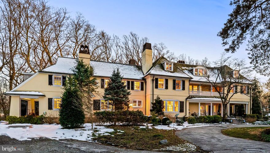THIS LISTING IS FOR 1920 MONTGOMERY AVE ONLY - 4.44 ACRES AND MAIN HOME
ANOTHER MLS LISTING IS AVAILABLE FOR 1920 AND 1904 COMBINED PARCELS LISTED FOR $3.2 M 

Come home to a classic estate on the storied Main Line. Built in 1900 for coal baron Edwin Saxman, this grand home sits on 4.44 acres in Villanova. This parcel (1920 Montgomery Ave only) comprises the 8,309-sq-ft home. This 3-story, 7-bedroom, 5 full- and 3-half bath stucco-on-stone Colonial was expertly designed by noted Philadelphia architect Horace Wells Sellers, a member of the committee that restored Independence Hall, Washington’s Headquarters in Valley Forge and other historic landmarks. The period architectural details are exquisite. From the grand staircase in the 2-story foyer, 11 wood burning fireplaces, hardwood floors, intricate moldings, bowed windows, arched doorways, built-in cabinets and 10 ft+ ceilings, the home’s classic beauty has withstood the test of time. Love to entertain? Rooms connect seamlessly with the main foyer and each other through sliding glass and French doors. Move easily from indoor to outdoor living, with expansive red brick and stone patios front and back, with covered porches, multiple seating areas and entry doors to several interior rooms. Across the foyer, abutting the living and dining rooms, a loggia—a room that can open to the outdoors and adjoining rooms—serves as a sunlit family room. With its tiled floor and triple arched French doors, it can easily be opened up to bring the outside in. Large windows and French doors in almost every room allow for abundant sunlight and views of the property’s natural beauty, with specimen trees and lush landscaping. Turn-of-the-20th century elegance meets modern convenience in the kitchen, butler’s pantry, breakfast room/wet bar and informal powder room, all renovated in 2004. The kitchen offers a center island with seating, SubZero refrigerator, Wolf range, refrigerator drawers, custom built-in cabinetry and desk, brick fireplace and access to both front and rear patios. Completing the first floor, a step-up “in-law suite” is currently used as an office. This section provides access to the 2nd level via back stairs to 2 guest bedrooms and bath above. Off the foyer, the grand staircase leads upstairs to a beautiful landing and hallway with 3 gorgeous chandeliers, complete with a sleeping porch, a nod to the days before central air. The primary suite has also been renovated for comfort and convenience. It includes a fireplace, a sitting room, multiple closets with built-ins, and 2 well-appointed luxury bathrooms—one of which pampers you with a soaking tub, steam shower, water closet, marble flooring, built-in cabinetry and a fireplace. Also on this section of hallway, 2 large bedrooms with fireplaces and walk-in closets share a renovated bath. On this level, you will also find the laundry room, with original cabinetry, as well as 2 additional bedrooms, another bath, and 2 storage closets. Another stairwell leads to the 3rd floor, which offers 2 bedrooms, a full bath and a large bonus room with fireplace, currently used as an exercise room. The original “silver closet” on this level is now used to store seasonal décor. The current owner has made many improvements, including a new cedar roof, copper gutters and downspouts; primed and coated flat and tin portions of roof; rebuilt fireplaces; HVAC system, outdoor lighting and sound system, and added 2nd electrical service. This grand property puts you right where you want to be, minutes from the shops and restaurants of Lancaster Avenue, with easy access to I-476 and other arteries and SEPTA rail, and in the coveted Lower Merion School District.