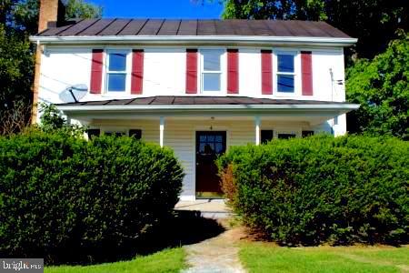 Two great homes - one low price! Move-in ready - live in one and rent the other or use second home for in-laws or home office. First home is a 3 bedroom Colonial (see listing details) with easy access for commuter routes to Maryland and Winchester, VA. It is an accessible Rancher with 2 bedrooms, large living room and eat-in kitchen plus laundry. Large covered porch has 2 entrances, one with a French Door. Recently painted, new carpet and updates to the bathroom and kitchen. Electric independently metered. Ample parking, generous over-sized lot with 3 separate outbuildings - workshop includes electric and heat, plus 2 sheds. Ideally situated for a tradesman. Use your imagination! Second home is NOT IN INCLUDED IN THE ASSESSMENT. This property is an estate and being Sold As-Is. Michael Briel is handling this property.