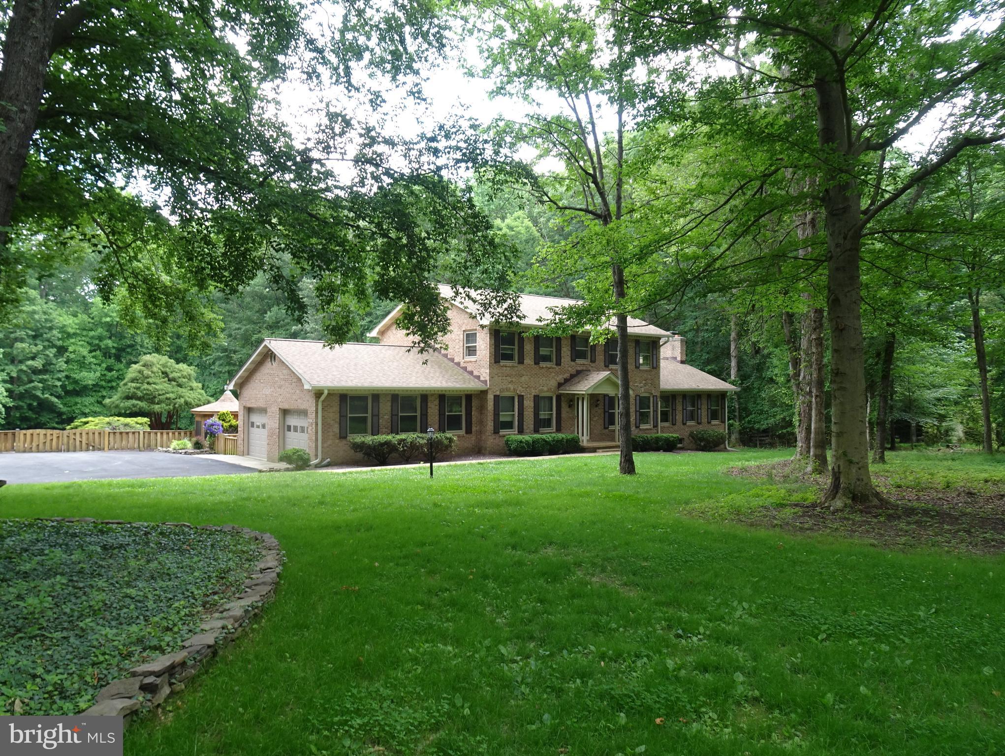 Enjoy the country setting! All brick house with spacious rooms. New refrigerator, stove and microwave. Family room has wood burning fireplace with insert. Upstairs bathroom has jetted soaking tub. One upstairs bedroom has it's own vanity with sink. Small deck off family room and mud room, both taking you to a full patio with a built in grill and a screened Gazebo. 2 car attached garage with openers. One pet case-by-case with $500 non-refundable fee. Shared driveway parking with apartment in detached garage listed separately. Rental Options: Rent Main House only for $2600/ Rent apartment only for $1750 or Rent House & Apartment for $4000. - No Subletting - All tenants/occupants must be screened and approved by Property Manager/Owners.
