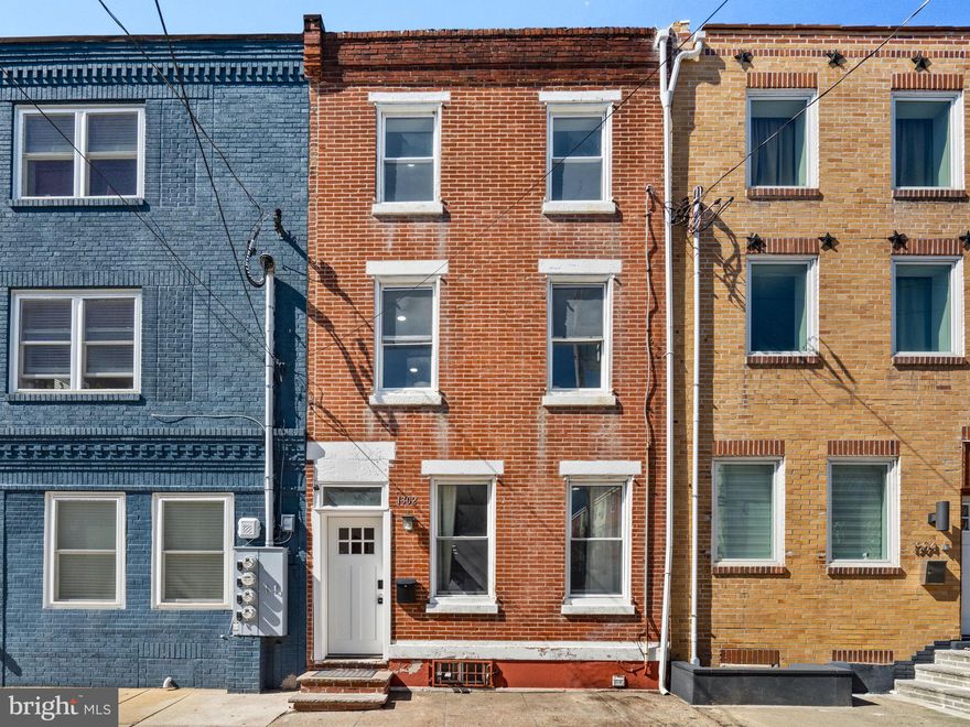 Welcome to 1302 N Lawrence Street — a renovated 3-bedroom, 2-bathroom home located in the heart of Olde Kensington. This home has a ton of space with over 1,500 sq ft, a great back yard and a location that is tough to beat! 

As you enter the home you're greeted by your gracious living space that gets a ton of natural sunlight from the east facing front windows.  You also have plenty of room to incorporate a dining area as well!  Through the living/dining area you have your gourmet kitchen with stainless steel appliances and plenty of counter space for both food prep and entertaining! You also have a walkout sliding door leading you to your back patio and yard, which will be great come the Spring and Summer time for all the hosting you can do. 

On the second floor you have two good size bedrooms with ample closet space and a full hall bath. On this floor you also have your laundry. The third floor has your primary suite with plenty of closet space and a brand new ensuite bath with modern finishes, stall shower and spa like soaking tub. 

Olde Kensington is no longer a best kept secret offering a great blend of walkability to Girard ave and public transportation along with plenty of cafes and award winning restaurants only a stones throw away.  You have easy accessibility to Fishtown and major arteries in and out of the city limits. Don't miss your chance to own this gem!