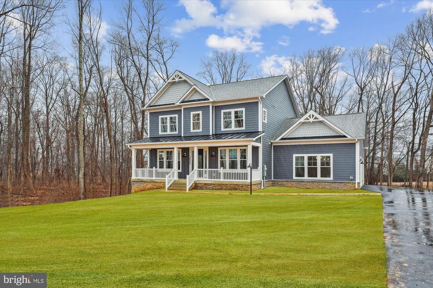 Welcome to a stunningly Brand-New Craftsman style home with a three-car side load garage that is nestled in a picturesque 1.6-acre lot. This elegant residence boasts five spacious bedrooms and five and a half baths, offering ample space for comfortable living. As you step inside, you're greeted by a sense of warmth and sophistication. The spacious layout provides ample room for both relaxation and entertainment, with a seamless flow between the rooms. The kitchen is a chef's delight, featuring white cabinets and decorative cabinets in the island to match the covered exhaust hood, exquisite quartz countertops, 36” range, wall oven with microwave, a perfect blend of style and functionality. Whether you're preparing a casual meal or entertaining guests, this kitchen is sure to inspire culinary creativity.  Added to this amazing floor plan is a large in-law suite on the main level with a private full bathroom. This versatile space adds a new dimension to the home, offering flexibility and convenience for various lifestyle needs. The family room directly off the kitchen has a stunning stone gas fireplace, cozy for those snowy days.  Large morning room with oversized windows for the scenic view of the back yard is designed off the kitchen for convenience.  Upstairs you will find a generous owner’s bedroom with  oversized walk-in closets, and an ensuite luxury bathroom. Three other large bedrooms, one with its own private bath and the two other bedrooms share a jack & jill bathroom.  For added convenience, the laundry room is located on the bedroom level.  The lower level is finished with a rec. room and full bathroom and windows to let the light in.  There is a convenient walk-up to the level back yard with partial woods.  With its timeless appeal and modern amenities, this brand-new home offers a rare opportunity to own a piece of luxury living.  Well water and septic means no water bills.  Propane tank that supplies the gas range, gas fireplace and gas heat for the main level and lower level for when the weather gets very cold.  NO HOA!!