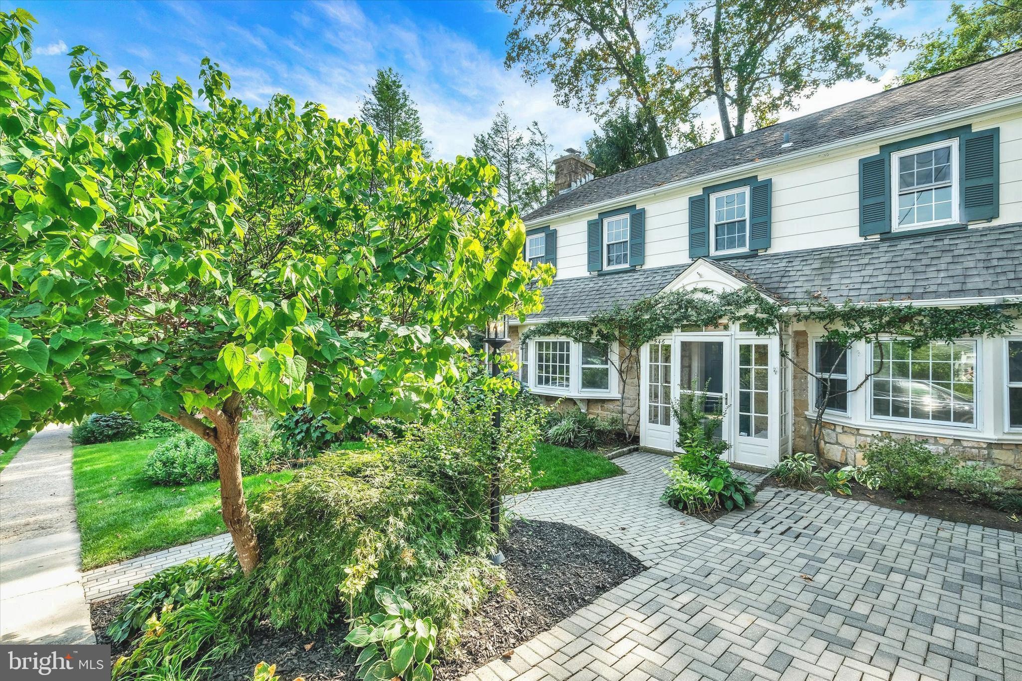 Welcome to 546 Bethan Road, located in beautiful Elkins Park, PA. Nestled in a quiet, tree-lined street, this move-in-ready home is full of charm and possibilities. With 3 bedrooms, 2/2 bathrooms and over 2000 sq ft of living space, this home is full of potential and ready for its next chapter. The curb appeal is simply gorgeous: a paver driveway, mature trees, flowering shrubs and established perennials frame the front yard, creating a warm and welcoming entrance. Enter into the foyer to find a classic, colonial floor plan. The large family room offers hard wood floors, a wood-burning fireplace, built-ins and a large bay window creating an atmosphere of warmth and comfort. The sun-filled dining room is conveniently located between the family room and kitchen for great flow. The kitchen has ample room with an island, custom banquette, newer dishwasher, newer cooktop and a slider to the deck. Off the kitchen find a powder bathroom and a den with built-ins: This flexible space can be used as a home office, playroom or even another bedroom. Step out back to a massive, multi-level deck - perfect for entertaining, relaxing or dining under the stars. The backyard is a gardener’s dream, surrounded by mature trees, flowering perennials and lush landscaping that offers privacy and year-round beauty. Plenty of space to play, plant or unwind. Whether you're hosting friends or sipping morning coffee, this space feels like your own private retreat. Head upstairs to find 3 spacious bedrooms and 2 well-appointed bathrooms. The primary suite has a custom closet and a large en-suite bathroom with double sinks, shower and tub. Head downstairs to find a partially finished walkout basement, powder bathroom and a large laundry room with tons of storage. The home offers a functional layout, generous room sizes and natural light throughout. It’s freshly painted and has a new attic AC unit. Conveniently located close to restaurants, schools and shopping. Easy access to major routes makes commuting a breeze, while the friendly community makes it easy to feel at home. Whether you're starting a family, building equity or simply ready to stop renting, this is your chance to own a piece of history with all the comforts of today. This home offers a wonderful blend of character, comfort and a backyard oasis you’ll never want to leave. Perfect for buyers who are ready to plant roots and grow something beautiful.