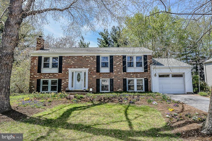 Gorgeous home! Shows like a model. 5 BR 3 full baths.Updated kitchen. Stainless  appliances. Gleaming wood floors  main level. Cozy screen porch with private deck +lovely landscaping.  Inside home just painted. New carpet  lower level. Huge family room brick raised hearth fireplace big "home office" area.Baths updated. Shutters freshly painted .Garage drywalled w/upgraded electricity. Dream home!