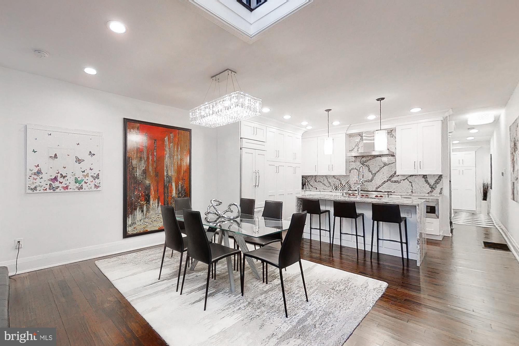 Absolutely stunning townhome in sought-after Rittenhouse Square location. 4 bedrooms with 3.5 bathrooms have all been newly renovated with the finest materials a discerning buyer could ask for. The kitchen design and finishes would be perfect for any and all entertaining with its top-of-the-line appliances. Plus, this home boast an elevator, which was original to the home when this seller purchased it. 2nd Floor entertainment area with fireplace and built-in wet bar. Conveniently, there is a powder room and spacious laundry on this floor as well. 3rd floor owner's suite featuring a luxurious bathroom and closet was custom designed to accommodate an extensive wardrobe. 4th floor with 2 more bedrooms and full bath. Home is complete with a rooftop deck that has outstanding city views. This is your opportunity to move into a sophisticated home in Greenfield district that wows at every turn. Do not miss!