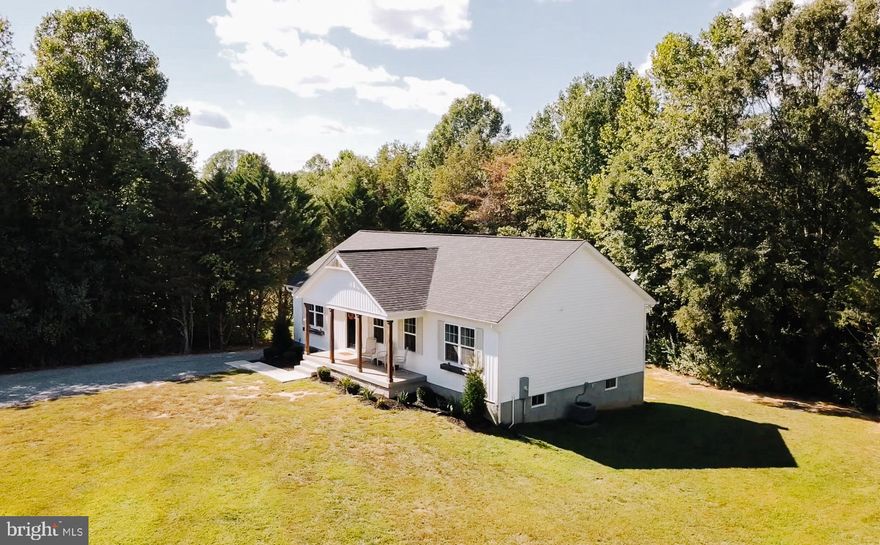 Dreaming of space, privacy, and a home where you can truly breathe — but still want to be close to Lake Anna, Fredericksburg, and everyday conveniences? This modern country home offers the best of both worlds: 6.5 acres, wide-open land, and a 2023-built home that’s move-in ready.

Located just minutes from Lake Anna Marina and the charming town center of Spotsylvania, this property is perfect for anyone craving peaceful country living with quick access to the water, restaurants, and shops.
Inside, you’ll find a bright, open-concept layout designed for gathering, hosting, and relaxing. The kitchen, living, and dining areas all flow together — ideal for holiday dinners, casual get-togethers, or cozy nights at home. The private primary suite sits on one side of the home, with two additional bedrooms on the other, giving everyone space and quiet when they want it.
Need extra room for guests, hobbies, or working from home? The finished walkout basement offers a 4th bedroom, full bath, and flexible bonus space. Perfect for a home office, media room, gym, or in-law or guest suite.
Step outside and enjoy 6.5 acres of open land — room to garden, explore, add a fire pit, or simply enjoy the peace and stars. Whether you're dreaming of a hobby farm, space for pets to run, or just a quiet place to unwind, this property lets you create the lifestyle you’ve been waiting for.
Homes like this — modern construction on acreage near Lake Anna — are hard to find. If you’ve been searching for land, privacy, and a newer home without the wait, this is the one you don’t want to miss.