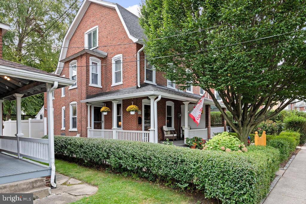 Move right into this tastefully updated Bryn Mawr twin. Walking through the front gate, you will pass through the front yard and up to a charming, covered, wrap around porch Entering the home you will find a cosy living room to your right, and a spacious dining room to your left, that adjoins a gorgeous, recently renovated kitchen with marble counters, abundant custom made, natural cherry cabinets with slow close doors and under cabinet lighting, and hand-laid tile imported from England for the floor and backsplash. There are high end appliances: a Bosch dishwasher, Fisher & Paykel Fridge, Kitchen Aid Range, and a built in microwave that also serves as a convection oven, Hudson Valley light fixtures and a Kohler cast iron farmhouse sink. Off of the kitchen, there is a mudroom/laundry room with a new half bath leading out to an adorable yard with a brick patio. The second floor and third floors offer three bedrooms, a dressing room, and an updated bath with a refinished claw foot tub with new fixtures along with a shower. There's central air, a new electrical service, new pex plumbing, a water softener, and the roof was replaced in 2021. The location can't be beat. It is steps away from many great shops and restaurants on Lancaster Avenue, and the Bryn Mawr Film Institute, Suburban Square, Villanova University, and Septa regional rail for an easy ride to Center City are all nearby. Make an appointment to see this special home today!