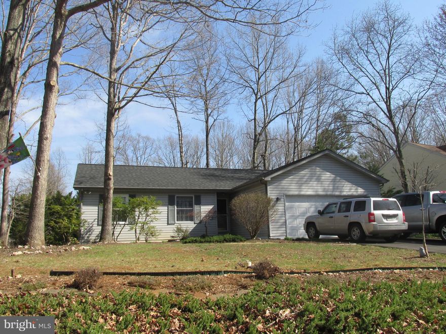 Ready for you to move in!  Open floor plan all on one level.   Pull your stools up to the large kitchen island with extra storage cabinets or dine in the adjoining dining room.All appliances are included.  Lots of room for your furniture in the spacious living room.  Master bedroom has wonderful, huge walk in closet.  Roof,HVAC driveway are  newer. For those sunny days, enjoy the exterior deck.