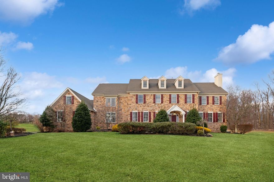 SPACIOUS & GRACIOUS! Drive down a tree lined cul-de-sac of just three homes to this exquisitely detailed luxury five Bedroom 5200+ sq ft property.  Extensive custom woodwork throughout. Three fireplaces. Great room open to superb gourmet Kitchen....  Enter fabulous foyer with site finished hardwood, true custom wainscotting, and impressive staircase. See through to the Great Room (used for casual living or entertaining) with detailed coffered ceiling to the true stone fireplace. The fireplace is flanked by oversized French doors to view the huge deck and bucolic rear 4.5 acres. The Great Room is open to the Kitchen with amenities that include timeless cherry cabinetry, granite countertops and subway tile backsplash.  A 14 ft, multi-level, island will certainly impress. Some of the additional high-end details of the Kitchen include a Sub-Zero Refrigerator, Dacor stainless steel appliances including double wall ovens, warming drawer and 6 burner propane stovetop. A well-located service area includes a pull-out pantry and bar sink and wine fridge. The breakfast area has room for all and there is also a large Dining Room for your more formal affairs. The stately Study boasts a floor-to-ceiling built in. Well situated away from the heart of the home is a stunning room - most recently used as a formal Living Room but could double for a Family Room. Extensive floor-to-ceiling woodwork surrounds a gas fireplace, and a private covered deck and patio can be found here. Also on this level is an upgraded Powder Room and Laundry/Mud Room with 2nd powder room, outside access, and entry from the 3-car garage. Ascend to the second level from the main staircase or the back staircase conveniently located near the Kitchen. The Main Bedroom suite is a "Knock Out".  It is great in size, has an amazing  2-tiered lighted tray ceiling, and a 2-sided fireplace from which you can see through to the sitting area, There is also a huge main walk-in closet plus two additional double closets. The oversized main Bathroom has an 8 X 5  glass shower, jetted tub, large double solid surface vanity, and more. The four additional large Bedrooms, all  (except one)have walk-in closets; one includes an ensuite bath. There are Jack and Jill Baths for two of the additional Bedrooms, with a hall entry for the additional Bedroom . The almost 2000 sq ft, Finished Basement with Full Bath is very versatile - enough open space to transform to any lifestyle.  On the exterior you'll enjoy both privacy and views from the enormous rear deck or the separate covered deck and patio.