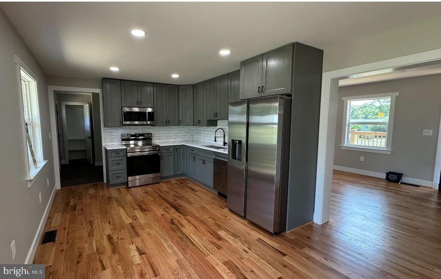 Gorgeous 2 levels home with lovely front and huge back yard. Completely remodeled from  top to  bottom  with timeless charm. This delightful home features:  new roof, siding, front porch with spectacular morning mountain view or relaxing evening. Stunning  new kitchen with granite counter top and appliances. Also new updated  bathrooms, and hardwood floor throughout the main level. Including new recessed lights, new dry walls on walls, ceilings, with fresh paint. New doors, windows, New electric panel and wires throughout the house. In addition new plumbing and A/C system with new duct works  throughout the house.  Full finished basement which expands your living space with endless possibilities for a recreation room, home office, or guest suite. New ceramic tile laid throughout the basement. Adds a cohesive and stylish touch to every room. This remodeled gem is ready to move-in  and waiting for you to make it your home sweet home. Don’t miss this opportunity!  it could be yours  to own a beautifully updated home in a coveted area. Please remove your shoes or use booties as requested by the seller. Thank you. Seller is willing to help closing costs.