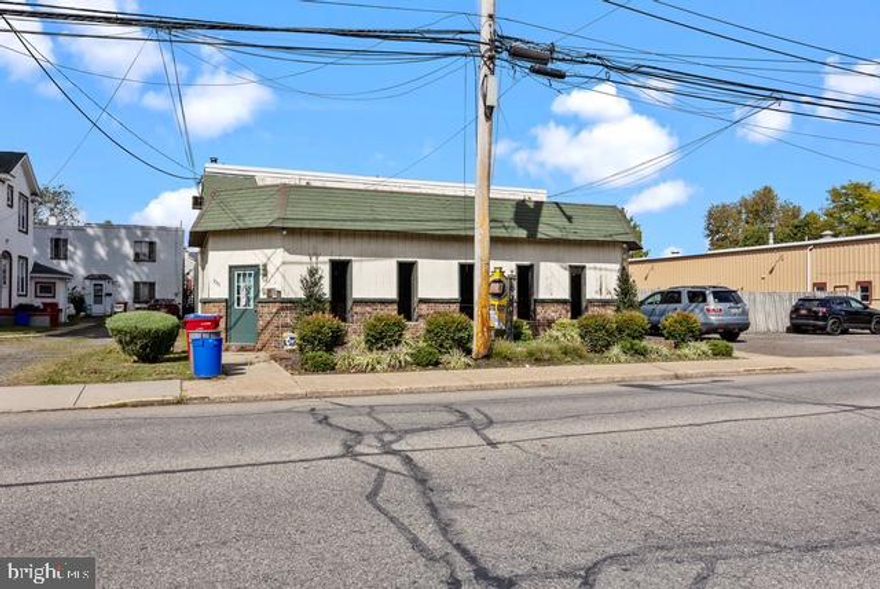 Up and running busy Auto Body shop located in Historical Bristol Boro!! Features customer sitting area, receptionist desk, back office, storage closets, two 1/2 bathrooms, 6 garages, 5 drive in doors, fenced, above shop has 2 bedroom apartment with 1 bath, long term tenant pays $900 a month, tenant pays electric only. separate meters, roof only 2 years old. above shop has been recoded 2 years ago, storage shed, one block from the Delaware river and much more!!