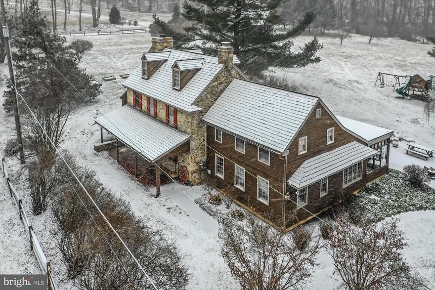 This circa 1700's home is in the National Heritage Protection District.  Situated on 3.2 acres it offers additions and renovations with updated amenities.  The spacious living room with walk-in fireplace has a new woodstove insert, random width flooring, exposed beams & built-in bookcases.  The formal dining room with it's random oak flooring provides seating for the largest family gatherings and an abundance of natural light.  The large updated kitchen offers oak cabinetry, double ovens, new ceramic cooktop & tile countertops.  The charming sunroom offers a serene viewing for the patio, grounds and pond.  The first floor laundry room with utility tub provides access to the rear yard.  The oversized master bedroom with exposed beams & ceiling fan has an attached master bath.  The second bedroom also has a ceiling fan.  The third bedroom provides that perfect get away for views from the window seats & provides built-in closets & cabinets.  The brick patio is the perfect spot for summertime entertaining.  The close by "garden shed" has been converted into an office, "she shed" or the perfect "guest quarters " with it's own covered porch/fans. The french door leads to a covered patio/porch. It is heated & cooled by a split unit.  The large barn can be used for storage.  The spring fed pond is stocked.  The chicken coop is ready for a new family!  The 3 car detached carport can be used for cars, farm equipment, etc.