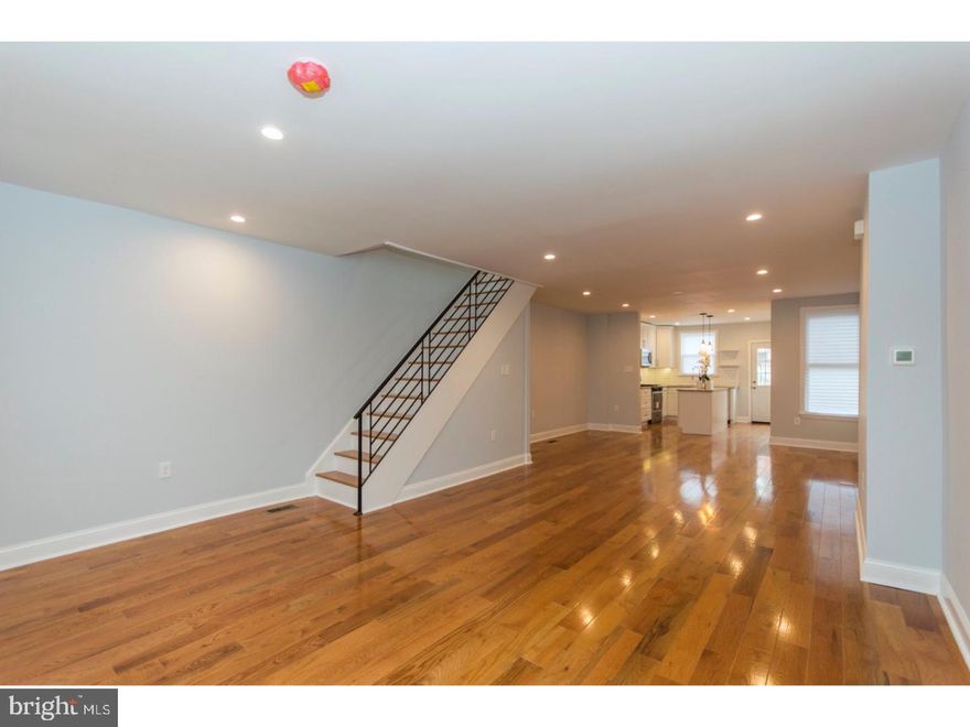 Welcome home to 7156 N. 19th St. - a newly-rehabbed 3 bedroom, 1.5 bath home in desirable West Oak Lane. Enter in through the enclosed porch and notice the open floor plan with gorgeous, new hardwood floors, new hardwood stairs with a custom iron railing and recessed lighting throughout. The gorgeous eat-in kitchen includes white shaker-style, soft-close cabinetry with crown molding, an abundance of counter space with gorgeous granite countertops, subway-tiled backsplash, a large island with pendant lighting above and all new stainless steel appliance package including a built-in microwave, built-in dishwasher and gas range. Exit the kitchen to the large rear deck which is perfect for summertime grilling with family and friends. The second level includes three spacious bedrooms with an abundance of closet space. The luxurious hall bathroom includes a double vanity with waterfall faucets, newly tiled floors, new dual-flush toilet, new tub with subway tile and hotel-style double shower heads, skylight and small nook perfect for your bathroom linens. The finished basement, which includes newly-carpeted floors, a powder room, separate laundry area and small garage, is great for your office, man/woman cave and/or room for storage. Enjoy the convenience of of-street parking in your private driveway. Over 1400 square feet with lots of closet space, storage and room for entertaining! Centrally located, minutes from 309, PA turnpike, 476, shopping, schools, restaurants and a short walk to public transportation. Just pack your bags and move right in!