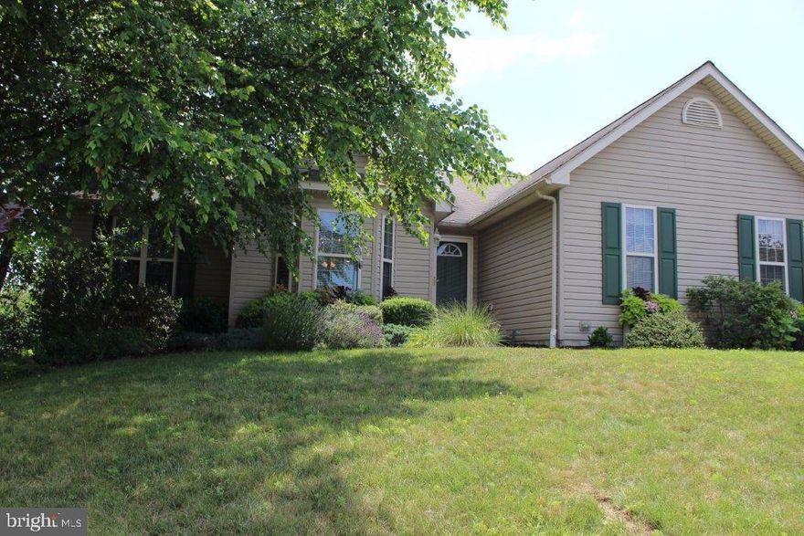 Bright and cheery one story living!  This home offers an open floor plan, beautifully landscaped yard and a cozy private sunroom.  Master bedroom and bath, fully finished family room with office space and loads of storage.