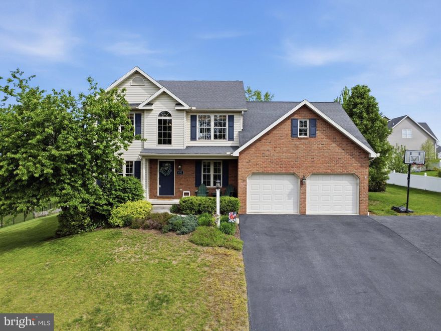 Lovely 2-story colonial in a desirable neighborhood with a spacious, functional floor plan. The main level features a open kitchen with breakfast bar and nook that opens to the cozy family room with fireplace, plus formal living and dining rooms for added entertaining space. Offering 5 bedrooms and 3 full baths, including a convenient main-level bedroom and nearby full bath—perfect for guests, use as an office or other flexible living needs. Main-level laundry adds everyday convenience. Enjoy outdoor living on the rear deck overlooking the backyard with mature trees providing shade and privacy and a fence for your pets. Full unfinished basement with walk-out exterior door provides excellent storage or future finishing potential.