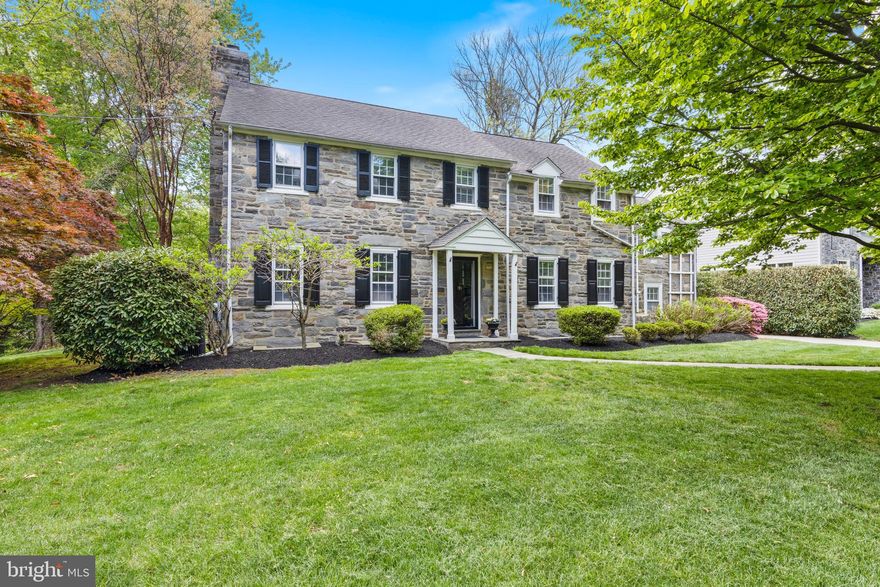 Welcome to 256 Hilldale Road, Villanova. Beautiful, classic stone colonial home situated on a picturesque tree lined street in the heart of Villanova, Radnor Township.  This special home has been updated and meticulously maintained!  Pull up to the stone wall front entrance and you will take note of the mature landscaping and specimen trees on this large level lot. Character abounds as you open the front door. Gleaming hardwood floors, center hallway, deep windowsills, crown mouldings  and all the little details throughout tell you this is a house of stature and quality, a pre-war beauty.  Off the center hall sits a large formal living room with classic built ins, beautiful mantle and wood burning fireplace. The formal dining room has 3 windows and plenty of room for hosting intimate dinner parties.  Off the dining room and center hall is the updated kitchen.  White cabinets, quartz countertops, farmhouse sink, stainless appliances, wall ovens, and a double window looking onto the backyard  complete the kitchen. Side step the kitchen to a step down family room and backsteps. The hardwood floors continue into the family room with a large bay window and built in shelves and cabinetry.  The kitchen also has a large pantry and is open to the breakfast room. With pendant lighting, this room hosts a large table and has French doors out to the expansive backyard. An additional bedroom with double closets and large full bath with double sink completes the first floor. This bedroom could also be used as an in-law suite, au pair suite or separate office. The second floor boasts 5 bedrooms and 3 updated full bathrooms. The hardwood floors, the mouldings, deep windowsills and character continues upstairs.  The primary bedroom has 3 closets and access to the primary bath and bedroom #2, which is currently used as an office.  Bedroom #3 and #4 share a jack n jill bath.  Step down to bedroom #5 which is off the backstairs as well and has private access to bathroom #3. In addition is large cedar closet for storage. The basement is large and unfinished with lots of potential plus a fireplace.  The two car, oversized detached garage has covered side area for grilling and seating.  The backyard opens to the lush and expansive flat lot, this is truly one of a kind in Radnor Township! Walking distance to all that Villanova has to offer, the University, Villanova Train Station, restaurants, shops, gym and yoga studios. As well as quick and easy access to major highways to head to the city, the airport, the shore or where ever you might head. Top rated Radnor School District, and close proximity to many private school options. Make your appointment today!