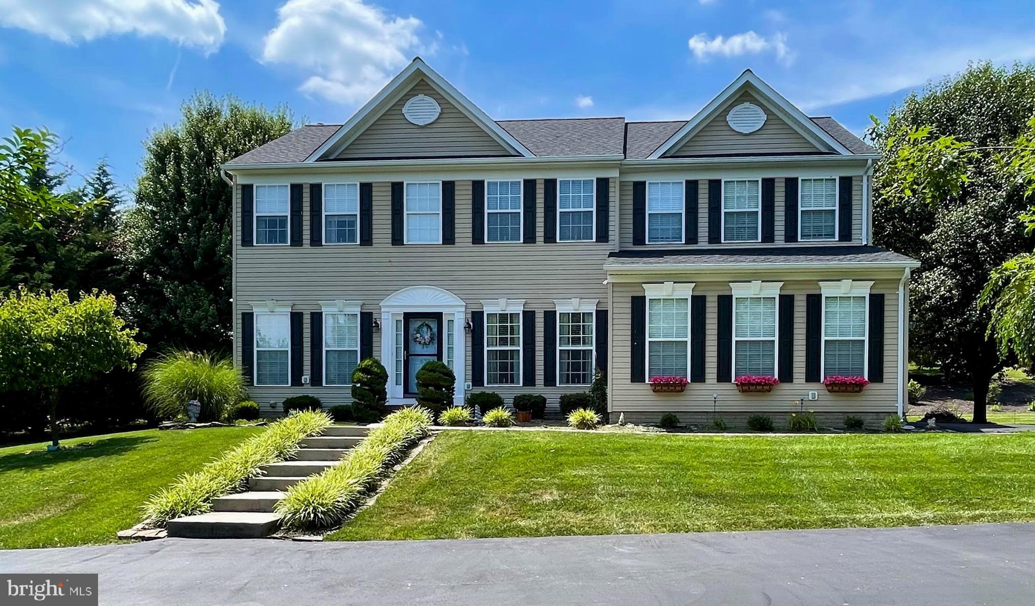 You won’t want to miss this stunning home, nestled among the trees in the highly sought-after Apple Knolls Estates! With 5 spacious bedrooms, 3.5 baths, and over 3,600 sq. ft. of living space across 3 levels, this home offers everything you could possibly need. From the grand foyer entry to the expansive 40-ft covered back porch, this home is designed for both comfort and style. The formal dining room, a light-filled office with French doors, and the inviting kitchen with an island and breakfast area are just the beginning. The cozy family room features a pellet stove, perfect for those cool evenings. Upstairs, you’ll find 4 well-appointed bedrooms. The generously sized primary suite offers two walk-in closets and a luxurious ensuite bath with a dual vanity, separate shower, and soaking tub. The fully finished basement features a complete mother-in-law suite, including a bedroom, kitchen, multi-purpose room, full bath, and another pellet stove. This private retreat has its own walk-out stairs and a separate parking pad. This beautiful home has been meticulously maintained, with a new roof installed in 2023, a new heat pump in 2022, and hardwood floors and crown molding throughout the main level. Step out onto the grand 40-ft porch with a vaulted roof, offering a serene and private space for outdoor entertaining. As an added bonus, the home is handicap accessible, featuring a ramp at the back porch and a chairlift to the second floor which can be removed if not needed. The home also includes a security system with video monitoring, which will remain with the property. Don’t miss out on this incredible opportunity – schedule your showing today!