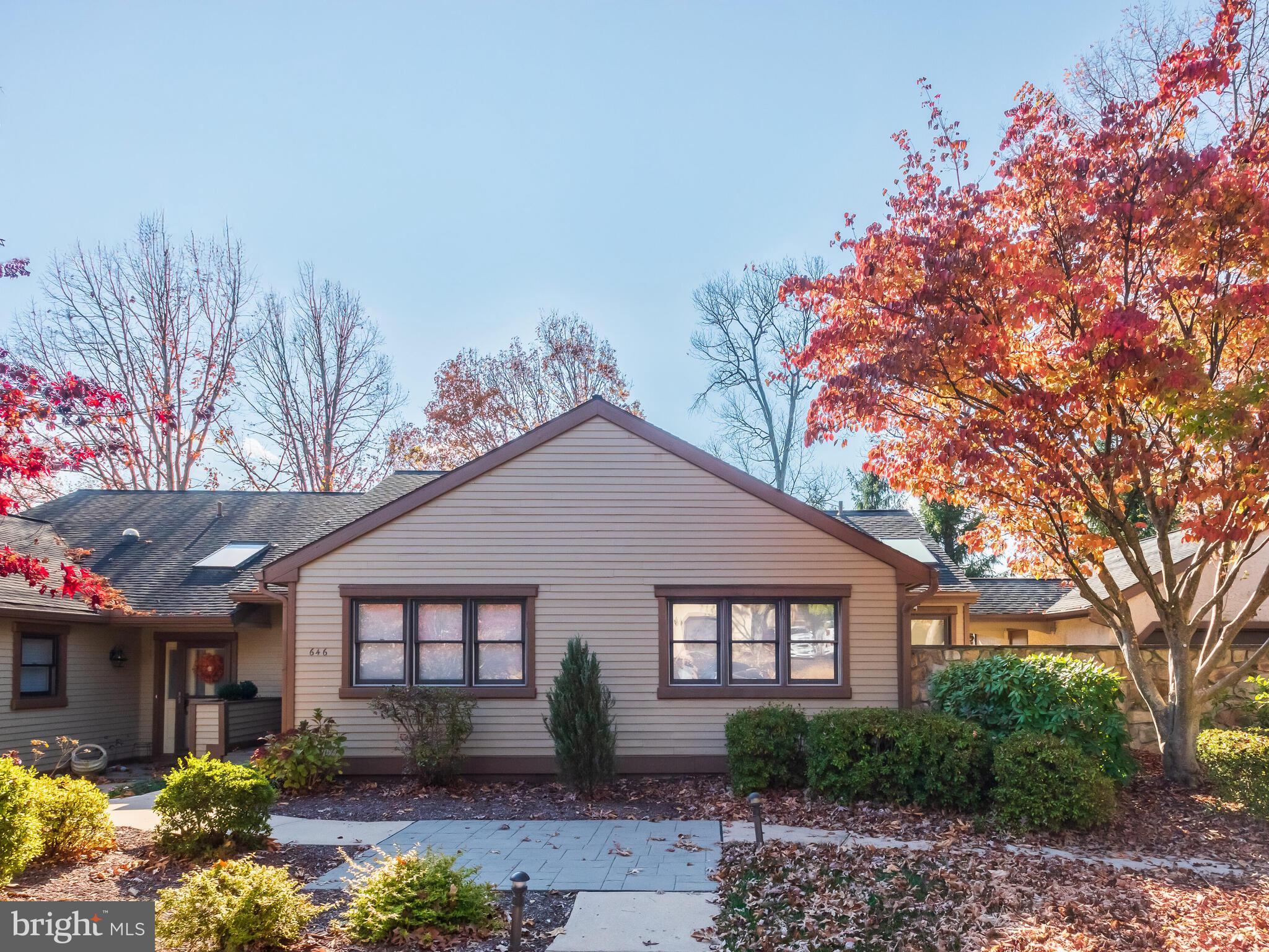 This Brandywine model in Heatherton Village was customized extensively by these original owners at the time it was built. There are so many special touches, many can be seen but others are things you can’t see. Enter this special home to a bright foyer with wood floor and 2 skylights, continue into the Living room that is flooded with natural light and has a woodburning fireplace with marble hearth and vaulted ceiling with skylights, then move to the Formal Dining room with tray ceiling and crown moldings, wood shutters, and sliding doors to private screened deck. The Kitchen has a tray ceiling, wood floors, solid cherry cabinets, granite counters, double ovens, stainless appliances, a cherry wood double pantry and a large breakfast area with vaulted ceiling. The breakfast room has a triple French door that leads to the newly resurfaced Deck with an electric awning. From the Kitchen you go directly to the Breezeway that leads to the garage. This provides wonderful access for staying out of the weather when arriving home and bringing in packages. On the Main Level is the Primary Bedroom suite that has sliding doors to a private courtyard, walk-in closet and en-suite Bath. The Primary Bath was upgraded in 2020 with a marble shower, rainfall and handheld shower heads, double vanity and jetted tub and skylights. To finish out this level is a 2nd bedroom, full hall Bath and the Laundry Room. The Loft has an open area overlooking the Living room, a Bedroom with wood floor and wood blinds, and a full Bath. The Lower Level was designed and built at the time the home was built to maximize space and utility and insulated to help with sound proofing. It has a large Great room with a solid ash bar with maple top sealed with a marine finish, under bar refrigerator, ice maker, and microwave. There is a propane gas fireplace, custom entertainment center, and sliding doors to the private, flagstone patio that is great for entertaining. The rest of the Lower level is finished with a Den/Bedroom, full Bath, Exercise room, and storage area with a Cedar Closet. There is a garage and space for 2 cars in the driveway. This home has crown moldings in most rooms, scalloped wainscotting, custom wall and window coverings and so much more. Visit the home for an extensive list of customizations. All this plus enjoy the wonderful lifestyle of an ACTIVE Gated Community with its many activities and mature landscaping.