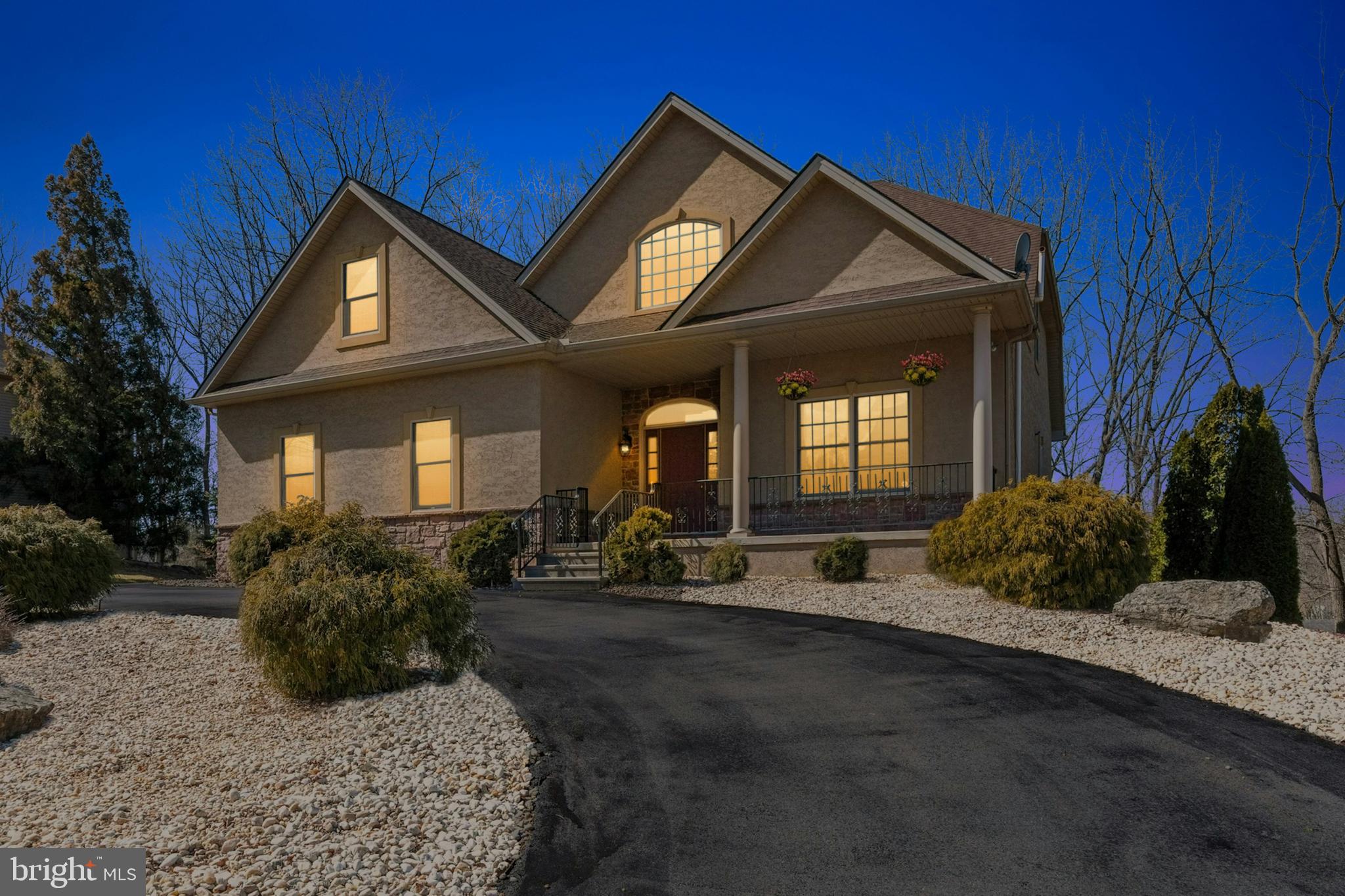 Tremendous curb appeal, a sizeable .4-acre lot, and superior amenities inside and out are the hallmarks of Cherry Avenue. A circular driveway and tall trees frame the well maintained home offering over 4,900 square feet of living space on three finished floors.
Soaring ceilings and elegant light fixtures are a welcome entry into this 2006 home. The floor plan is enhanced by gleaming Brazilian wood and granite floors, abundant windows, crystal chandeliers and large rooms. The heart of the home is a 2-story great room with gas fireplace, and an adjacent formal dining room. A stunning gourmet kitchen shines with stainless appliances, cherry cabinetry, granite countertops and a walk-in pantry. The first floor primary suite includes a large walk in closet outfitted with custom organizers, and a luxurious bath with dual sinks and jetted tub. The second floor offers two large bedrooms, an updated hall bath, and an additional full suite.
The fully finished walkout lower level includes a cherry wood bar with kitchenette, along with flexible spaces for a media room, recreation room, and exercise space. The low maintenance backyard boasts a screened in gazebo to take in the long distance views.
The quiet neighborhood setting is in close proximity to Bushkill Creek, St. Luke’s Hospital campuses, Routes 611 and 33, and upscale shopping and dining destinations in every direction.