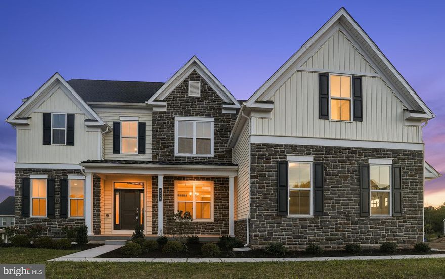 PRICED below Seller's purchase price -MOTIVATED seller is ready to make a deal today!  Move-In Ready New Construction in Sold-Out Meadows of Longview –highly sought  Spring-Ford School District . From the moment you arrive, the striking front elevation and grand entry foyer set the tone, highlighted by a sweeping curved staircase and rich hardwood flooring throughout the main level. Formal living and dining rooms provide elegant spaces for entertaining, including a tray ceiling and butler’s pantry leading to the heart of the home The dramatic two-story family room is the centerpiece, featuring soaring ceilings, a wall of windows, and a gas fireplace—creating a bright and inviting gathering space. The chef’s kitchen impresses with fine cabinetry, upgraded appliances, quartz countertops, oversized island, and a spacious walk-in pantry—ideal for everyday living and hosting. A main level bedroom with full bath offers flexibility for guests or a home office. A thoughtfully designed mudroom and laundry area connect directly to the three-car attached garage, keeping daily life organized. Upstairs, retreat to the expansive owner’s suite complete with sitting area, two walk-in closets, and a spa-inspired bath featuring dual vanities, oversized shower, and upgraded tile. Additional bedrooms are generously sized, including one with a private bath and two sharing a well-appointed Jack-and-Jill bathroom. The full daylight walkout lower level is ready for your finishing touches, offering endless possibilities for additional living or recreation space Thoughtfully curated throughout, this energy-efficient home blends comfort, elegance, and functionality. With the community fully sold out, this is a rare opportunity to own a showcase property without the build