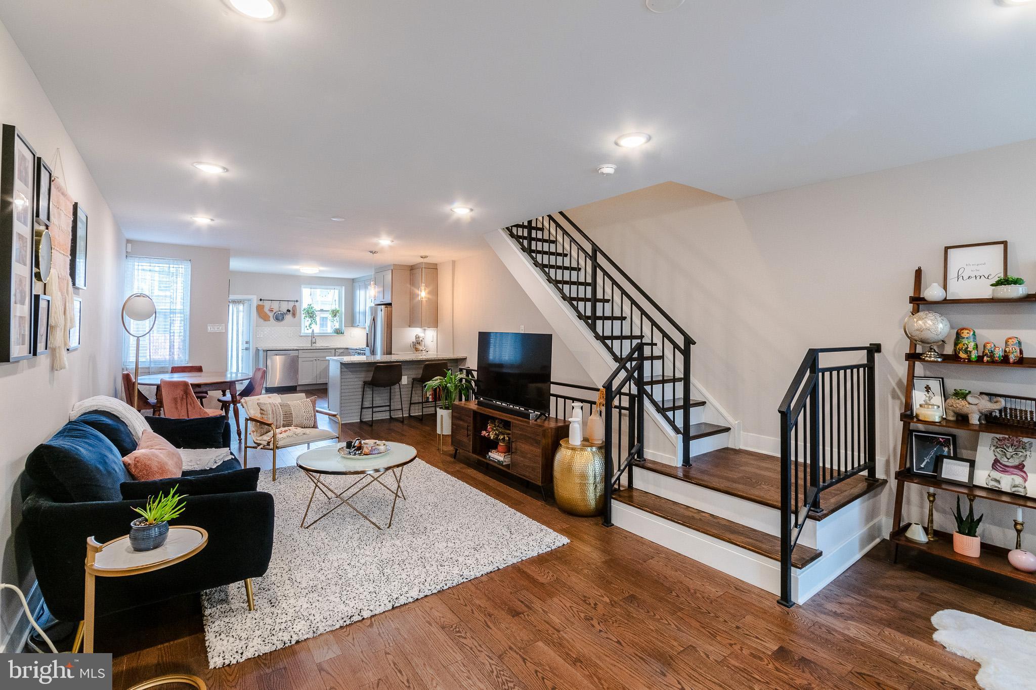 ** TAX ABATEMENT THROUGH 2029 ** Welcome to 4841 Larchwood Ave, a beautifully updated 3-bedroom, 3-bathroom home on one of West Philly’s most charming, tree-lined blocks. With a lush front garden, a rear deck off the kitchen, and two off-street parking spots (yes, two!), this home brings together space, style, and unbeatable convenience in the heart of Cedar Park. Completed as a full-gut renovation in 2019, this home still has a tax abatement through the end of 2029! Step inside to a light-filled sunroom that’s perfect for morning coffee or plant life galore. The open-concept living and dining area is warm and inviting, with hardwood floors, recessed lighting, and plenty of room to stretch out or entertain. The kitchen is a total standout, complete with granite countertops, breakfast bar, subway tile backsplash, pendant lighting, and a full lineup of stainless steel appliances. From the kitchen, head out to your rear deck, ideal for summer grilling or chilling. Upstairs, the second floor features two generously sized bedrooms and two full bathrooms, including a sunny primary suite with a walk-through closet and a spa-like en-suite bathroom featuring a rainfall shower and glass enclosure. The hallway bathroom hosts a tub, which is great for bathing kids, pets, or yourself! Down the open staircase from the living room, you'll find a fully finished basement with a full bathroom, laundry closet, and a flexible third bedroom that also works great as a home office, gym, or guest suite. There's even an additional bonus space to be used for whatever you can dream up. Thoughtful updates and finishes throughout give this home a clean, modern vibe without sacrificing its original charm. With all the updated systems throughout and perks like a Nest thermostat and ADT security equipment, this home is 100% move-in ready. All of this, just steps from Baltimore Ave, Clark Park, Mariposa Co-op, ReAnimator Coffee, Loco Pez, Vietnam Cafe, Carbon Copy, and all your favorite trolley and bus lines. Super accessible to Penn, St. Joe's, Crexel, CHOP, and HUP too! If you've been waiting for the perfect Cedar Park home with the updates you want and the parking you need, this is it. Make your appointment today!